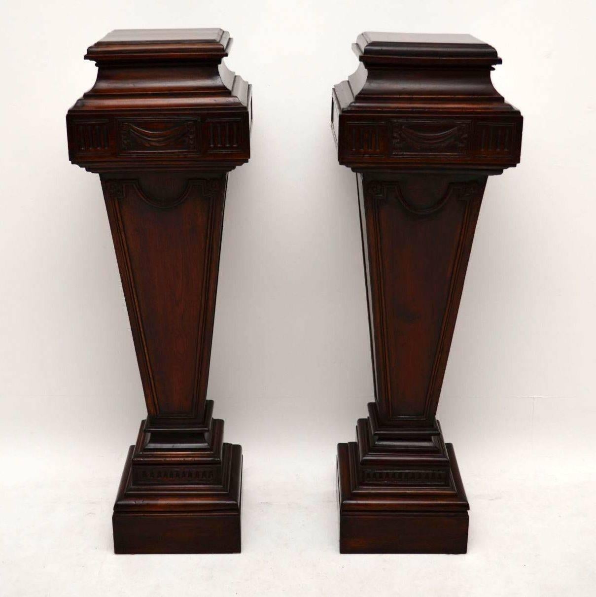 Very impressive large pair of antique mahogany pedestals. They are classical style and very imposing. Please enlarge all the images to see all the carvings and relief work. They have just been French polished, so are in good condition and I would