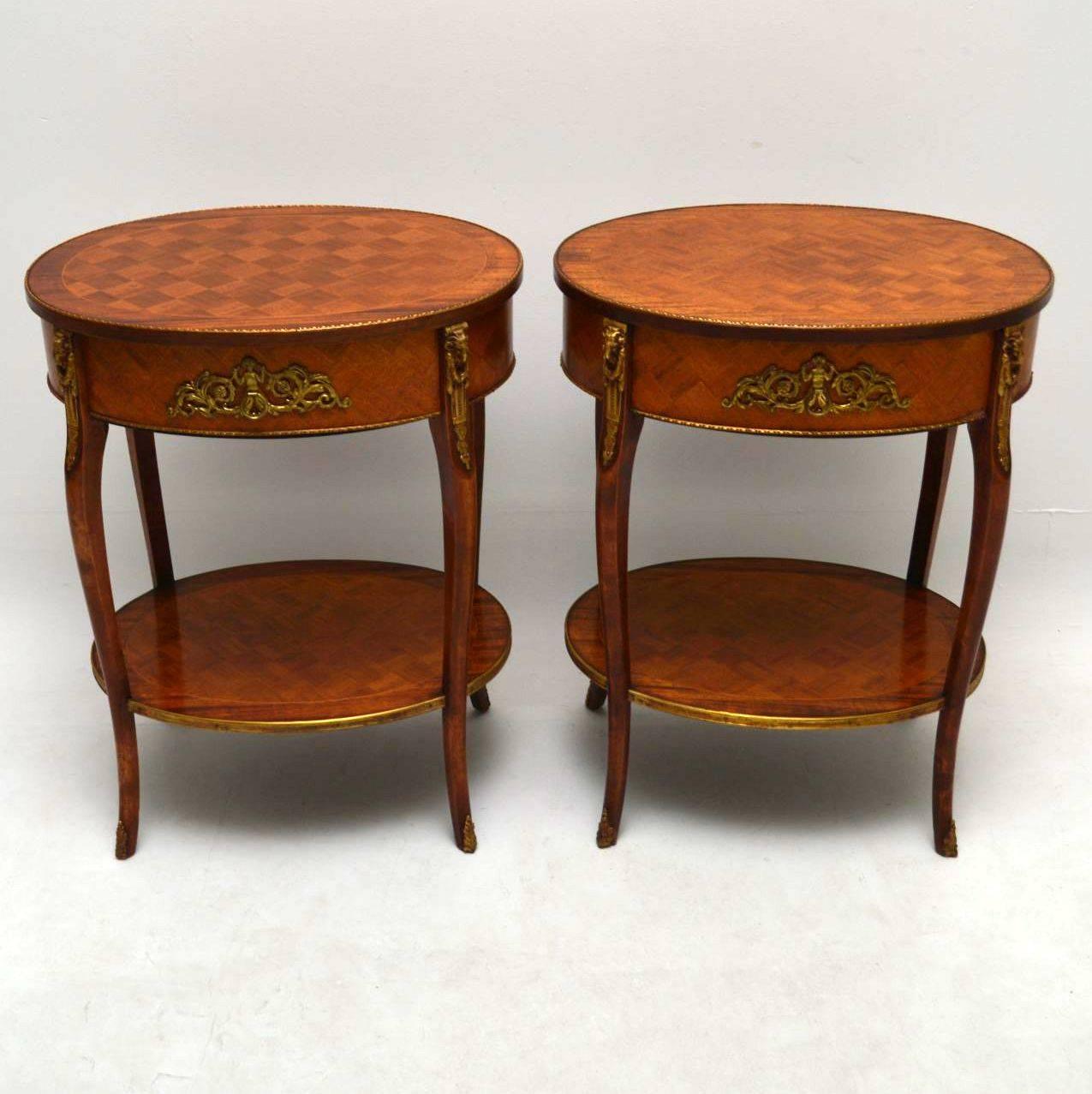 Pair of antique French parquetry lamp or side tables with gilt bronze mounts, handles and feet. The mounts are very good quality and check out the rams heads mounts on the tops of the legs. The table tops and lower tier tops have parquetry with