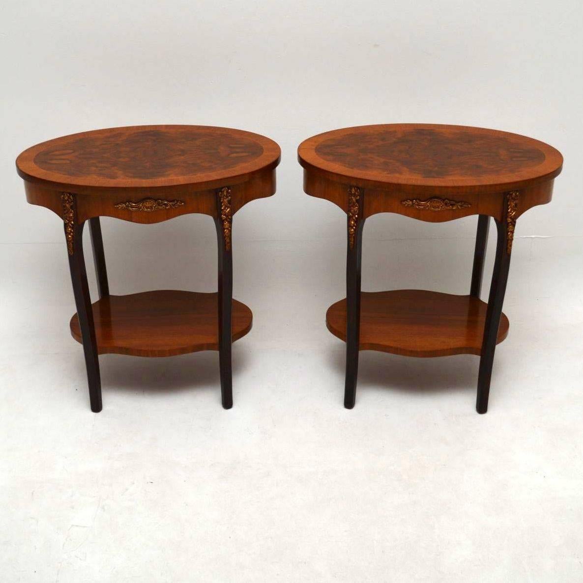Pair of antique oval French style side tables that are the ideal height for lamp tables either side of a sofa. They are in great condition, having just been polished and I would date them to around the 1930s-1950s period. The tops are burr walnut