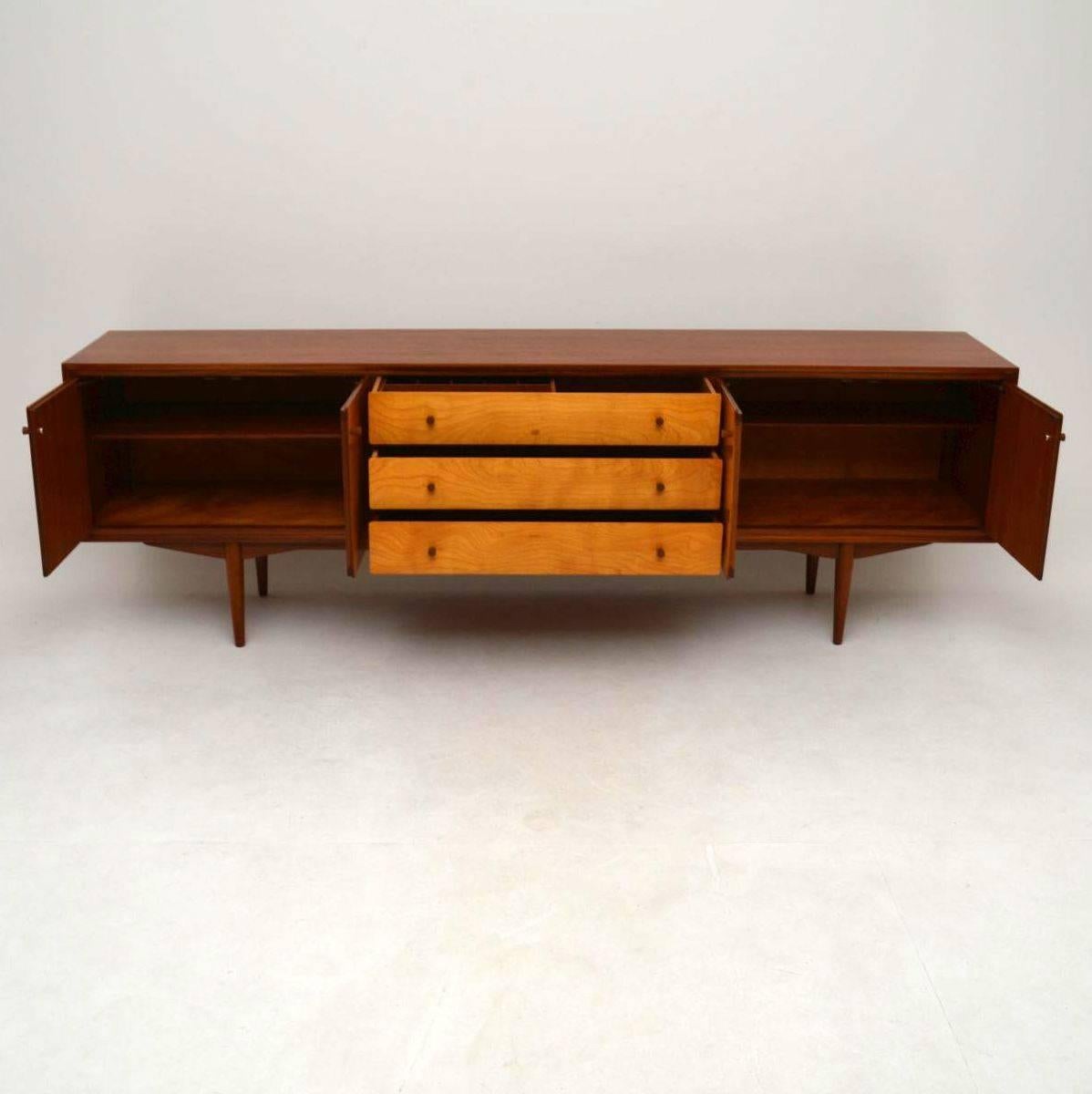 A beautiful and elegant vintage sideboard, this dates from the 1960s. It is of superb quality, it has a Teak carcass and satin wood front. We have had this fully stripped and re-polished to a very high standard, the condition is excellent