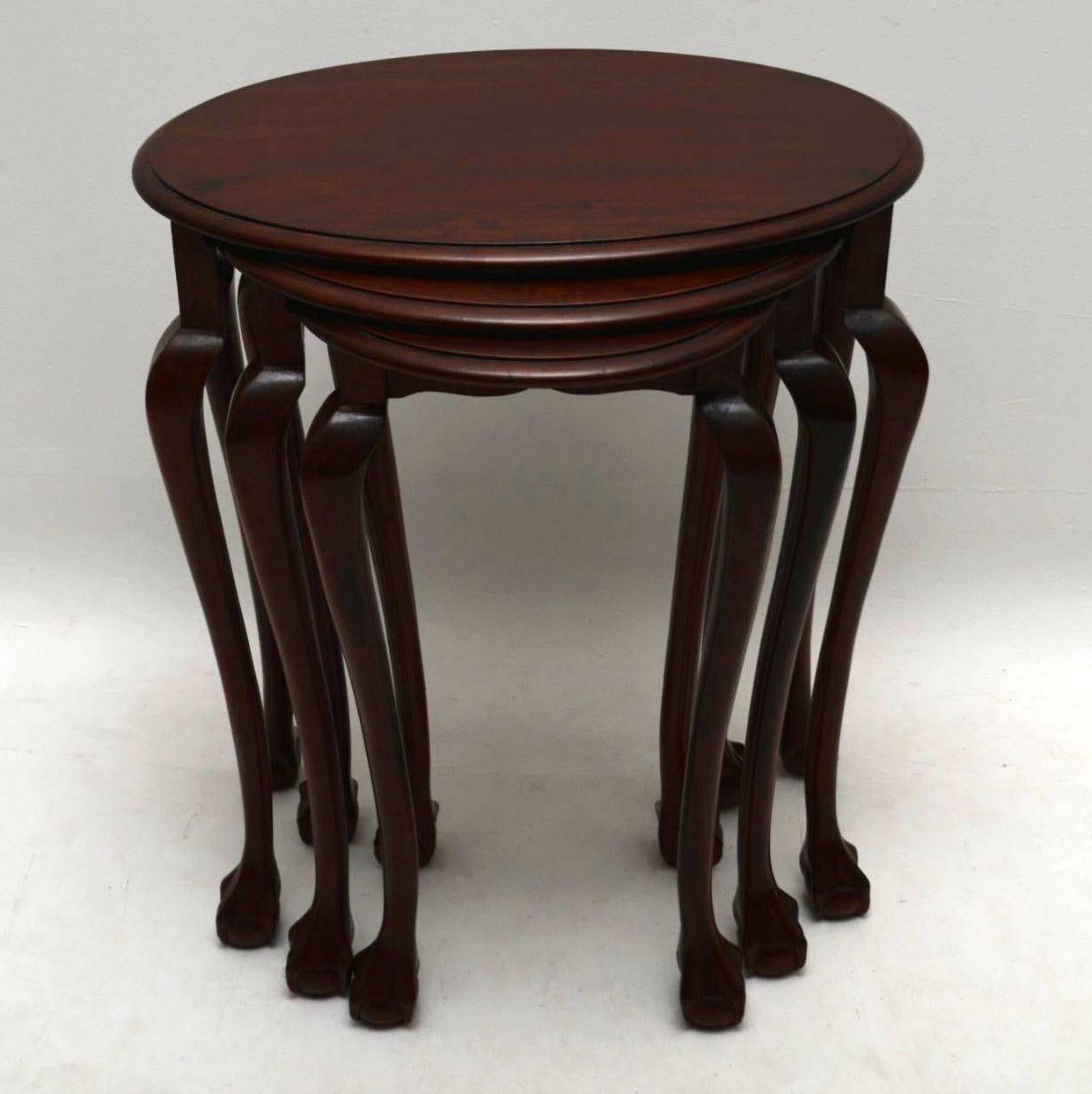 Antique Edwardian solid mahogany nest of three tables, with oval tops and well shaped legs with ball and claw feet. This nest is in good condition throughout and the tables have all been French polished. They date from the 1900-1910