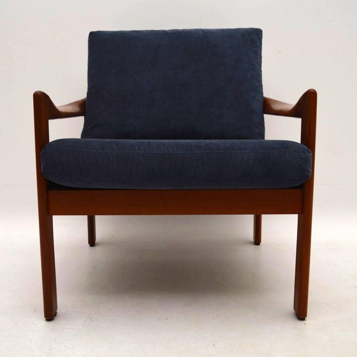 A stunning and rare Danish vintage armchair in solid teak, this was designed by Illum Wikkelso for Niels Eilersen, and it dates from the 1960s. The condition is superb for its age, the solid teak frame is clean, sturdy and sound; we have had the