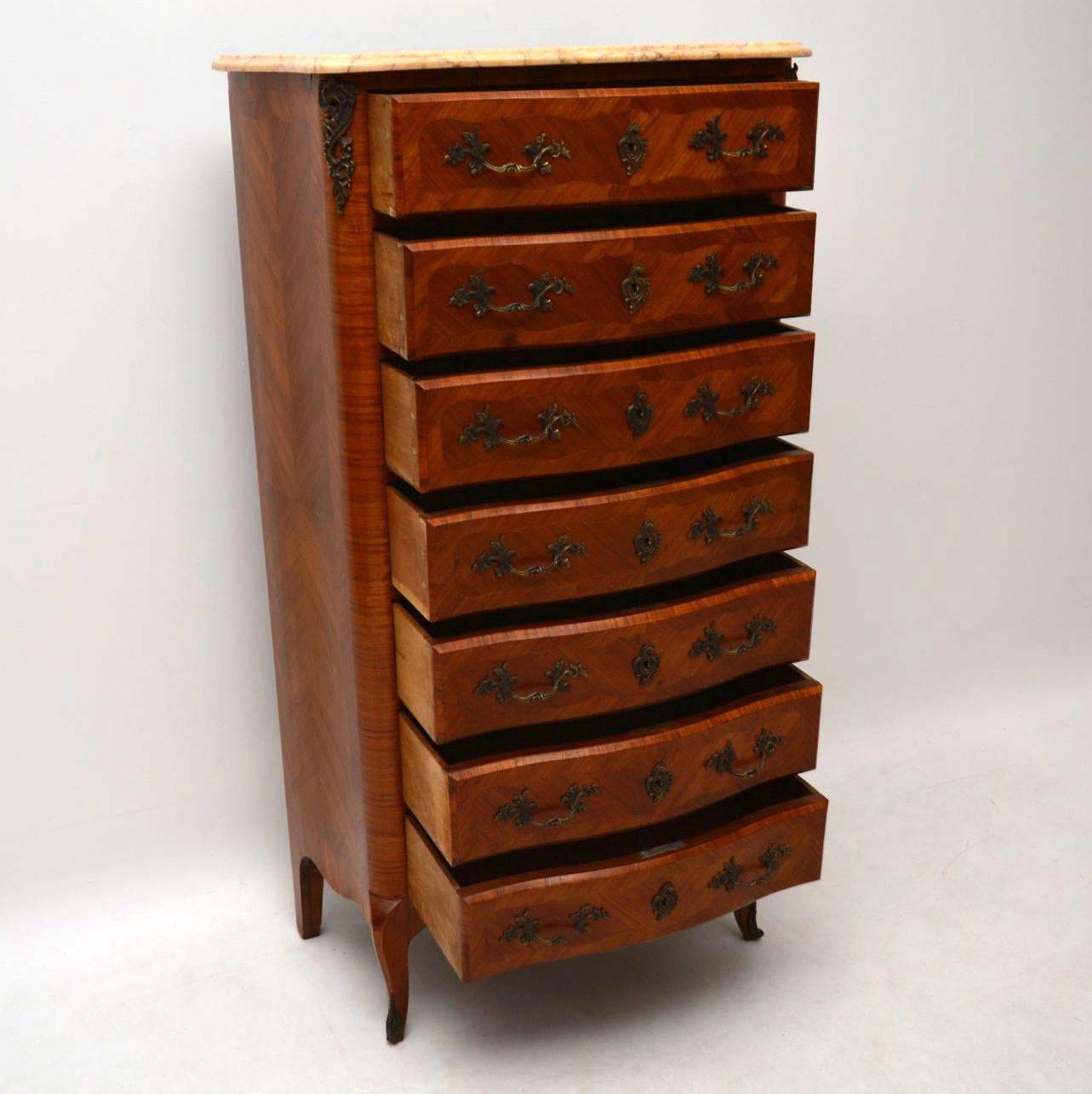 Tall antique French marble-top chest of drawers in kingwood with cross banded sides and drawers. The chest is in very good original condition and dates from circa 1890-1910 period. The sides are curved, the front is serpentine shaped and it sits on