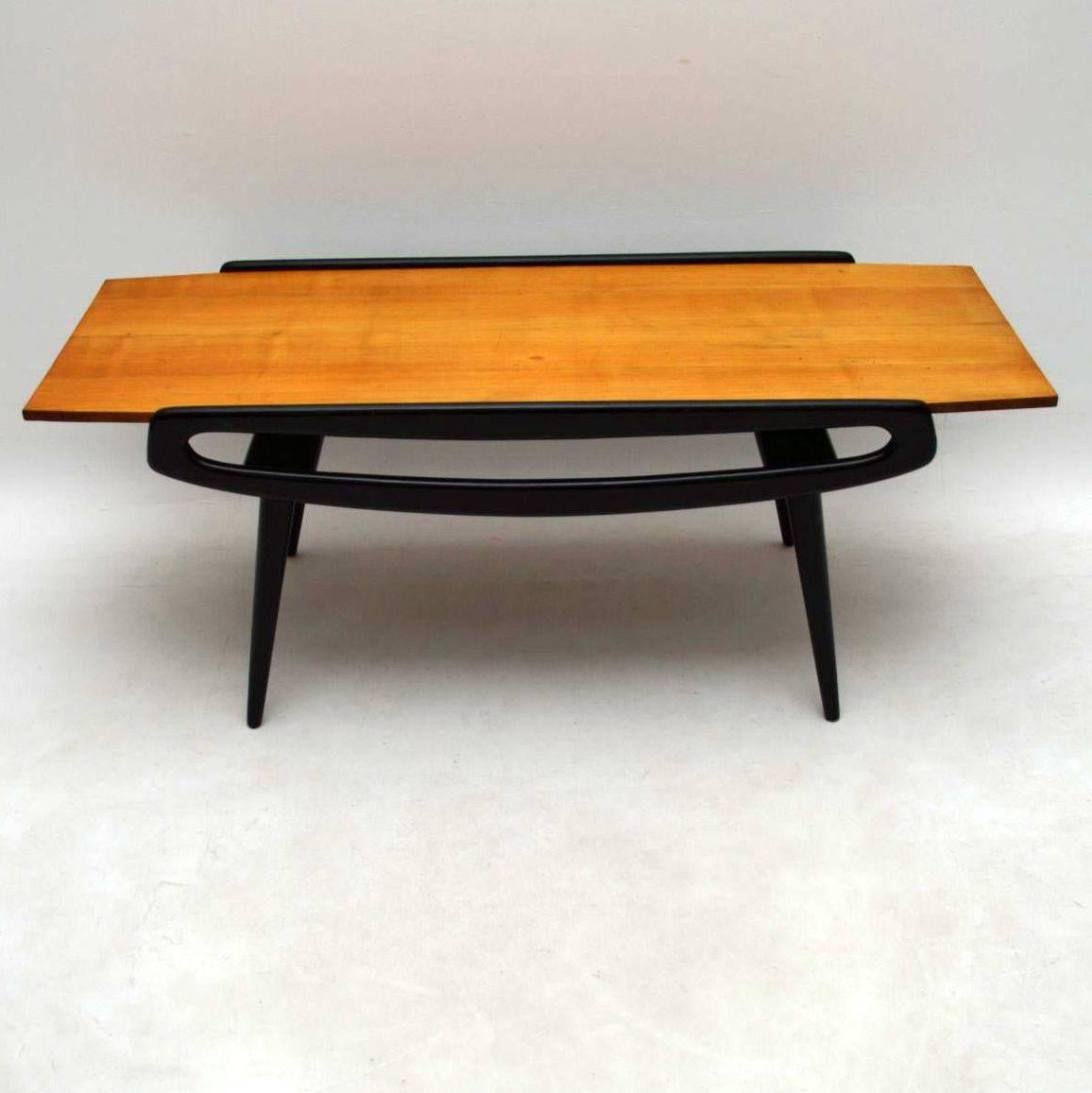 A beautiful coffee table dating from the 1950-1960s, this was made in Italy and is very elegantly styled. The top is Sycamore and the frame is ebonized solid wood. The condition is very good for its age, with only few minor marks to the polish on