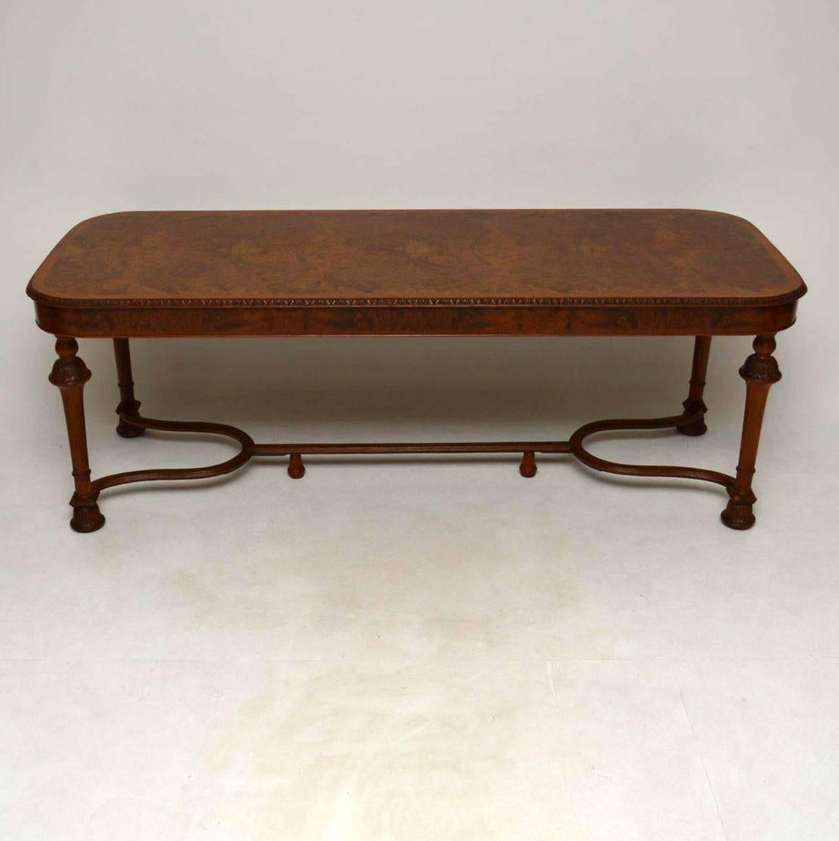This top quality walnut long dining table is capable of seating eight to ten people and it's in great condition dating from circa 1920s period. The top is a very dense burr walnut surrounded by a figured walnut cross banded and carved top edge. The