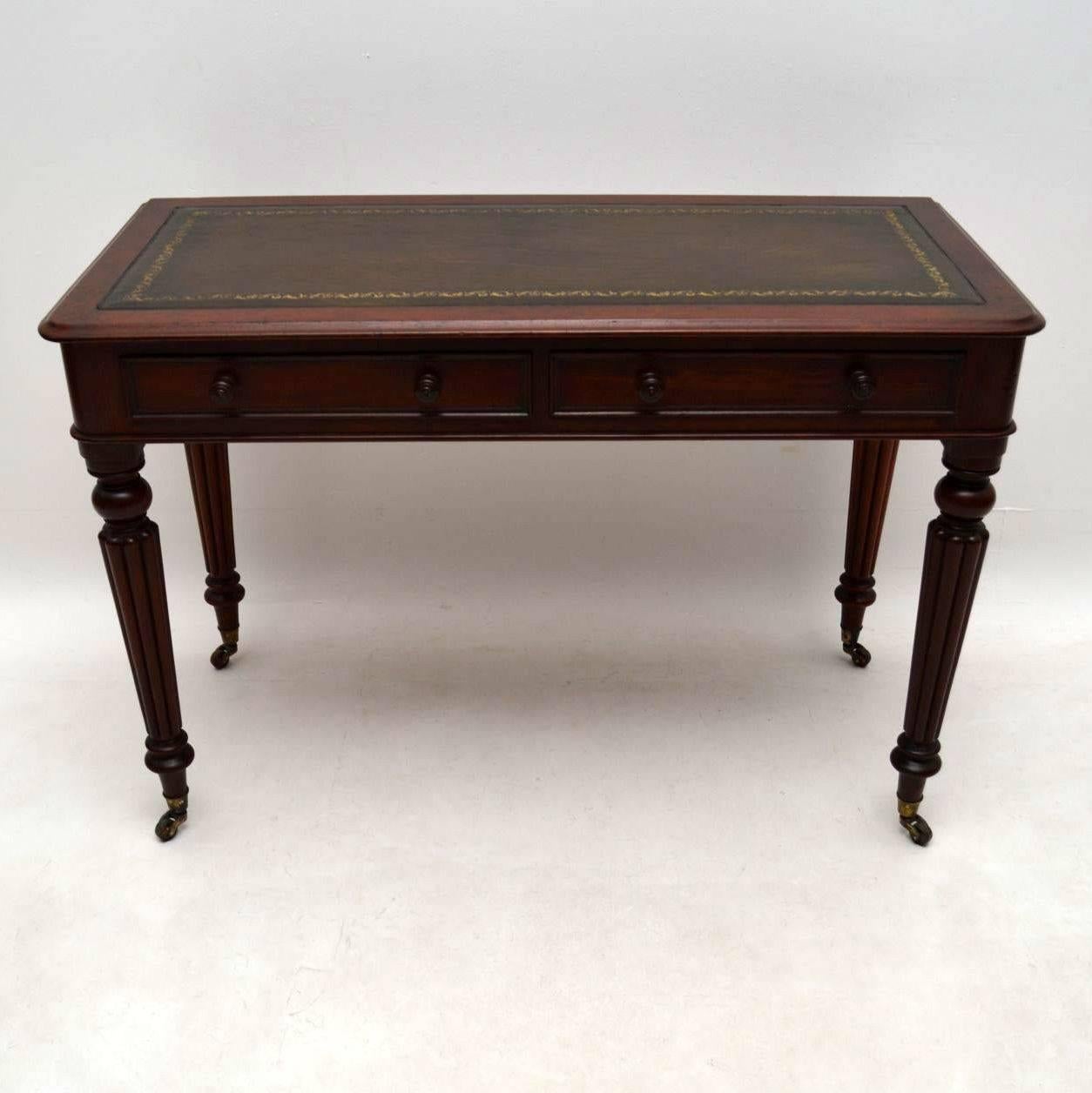 Fine quality early Victorian writing table from the 1840s-1860s period with plenty of character and many nice details. It has a tooled leather writing surface and two drawers below with turned mahogany handles and fine dovetails. It sits on turned