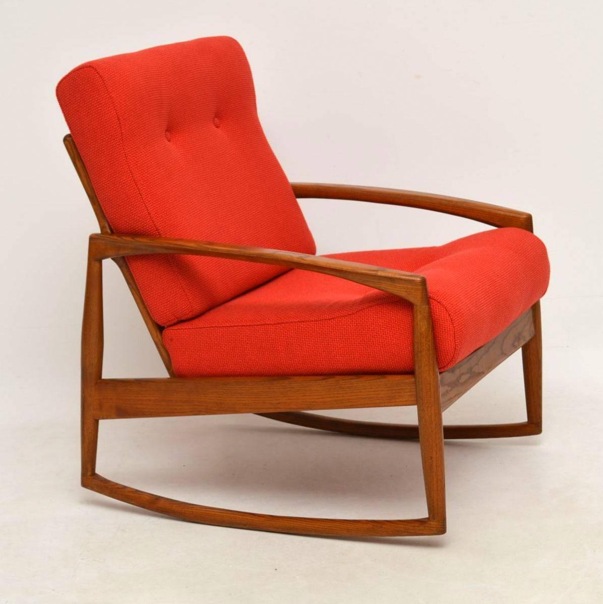 A stunning and extremely rare vintage rocking chair, this was designed by Kai Kristiansen and was made in Denmark during the 1960s. The solid wood frame looks like Elm or possibly oak, it’s hard to tell. It has striking grain patterns and a