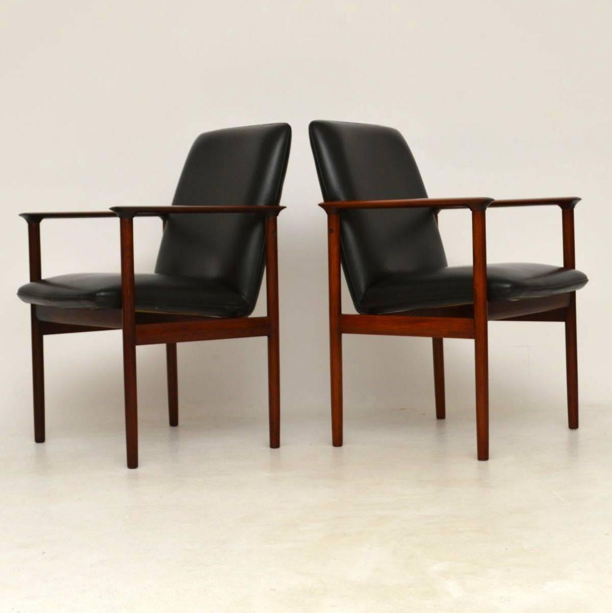 A very smart and top quality pair of armchairs, these were made in Denmark, they were designed by Arne Vodder, and they date from around the 1960s. The condition is superb for their age, with only some extremely minor wear to the polish here and