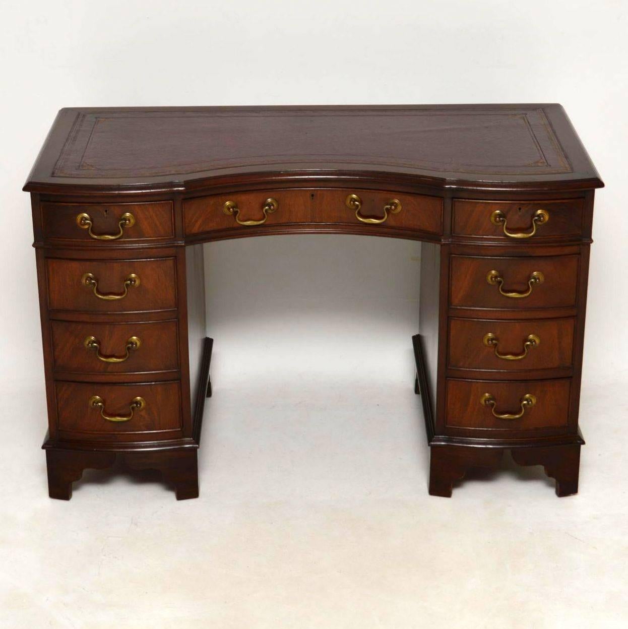 Antique mahogany leather top pedestal desk in lovely condition & with plenty of character. Although this desk isn’t particularly large, it still has a generous knee-hole space, because the drawer sections aren’t too wide. The pedestals are bow