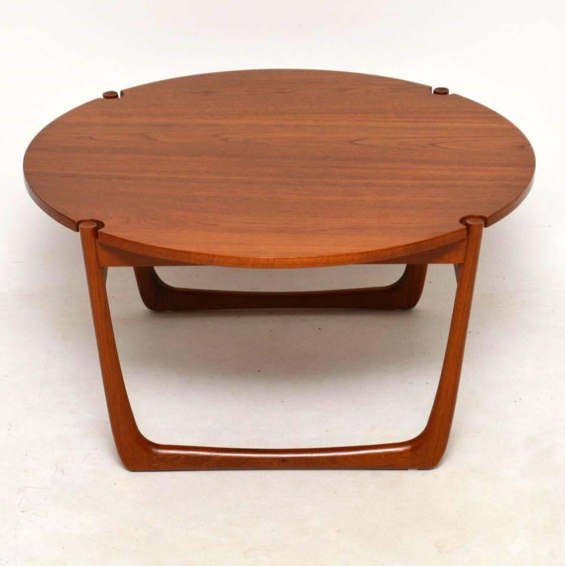 A beautiful and rare vintage coffee table in Teak, this was designed by Peter Hvidt & Orla Mølgaard Nielsen and it dates from the 1960s. This is a stunning design with a large circular top and wonderful sleigh legs. We have had this stripped and