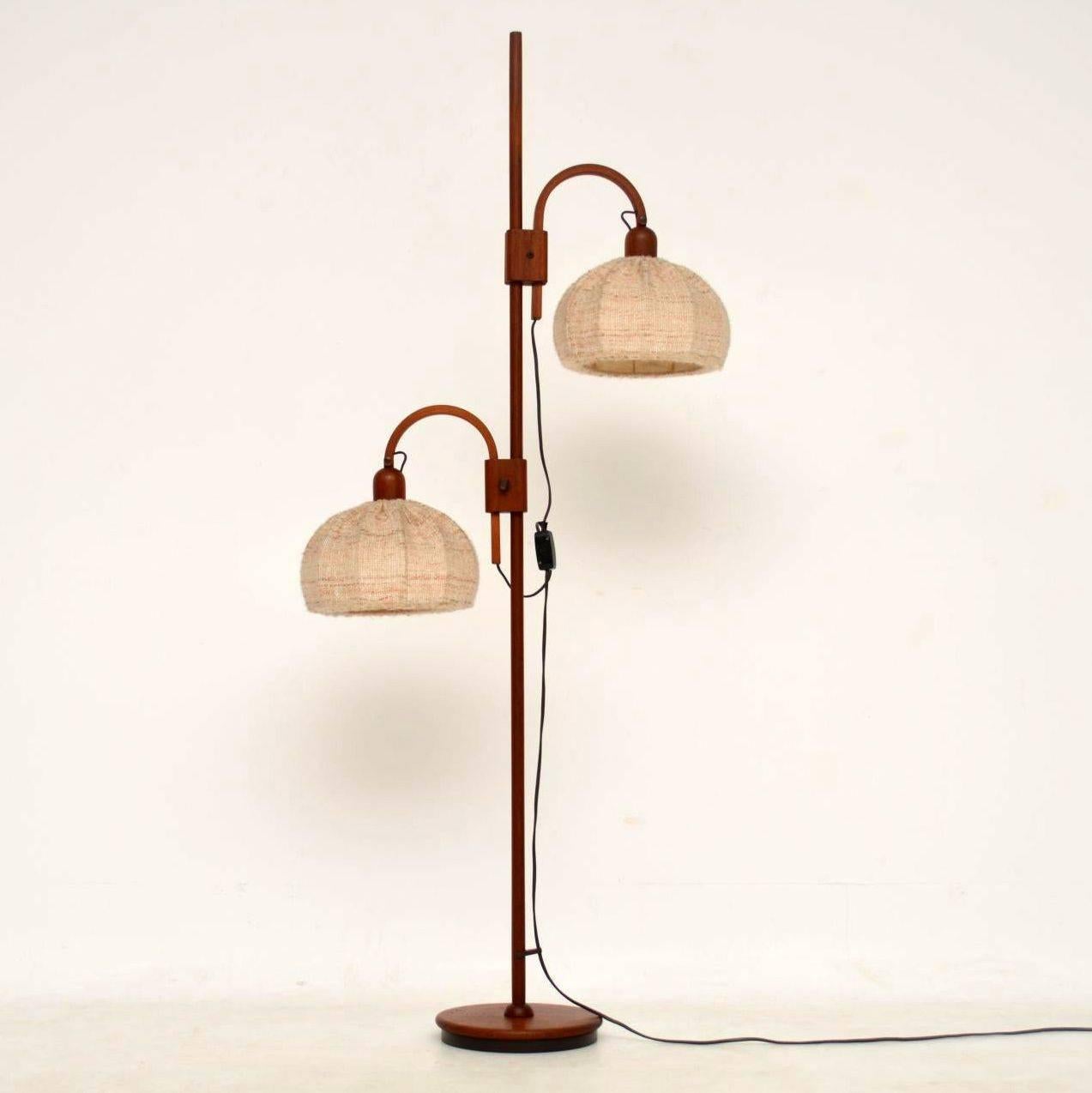 A fantastic vintage Danish floor lamp in teak, this dates from the 1960s. It is in amazing condition for its age, the wool shades just have some minor wear. This has two adjustable heads that can be raised, tilted and swivelled to various positions,