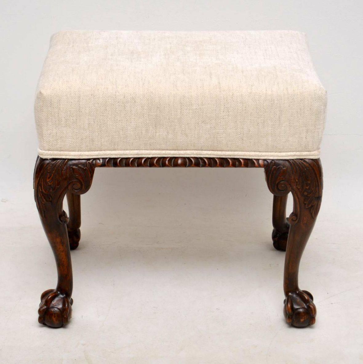 This antique mahogany upholstered stool dates from around the 1890’s period & is designed very much in Chippendale manner. It’s beautifully carved around the seat & on the legs which have claw & ball feet. This stool is in very good condition & has