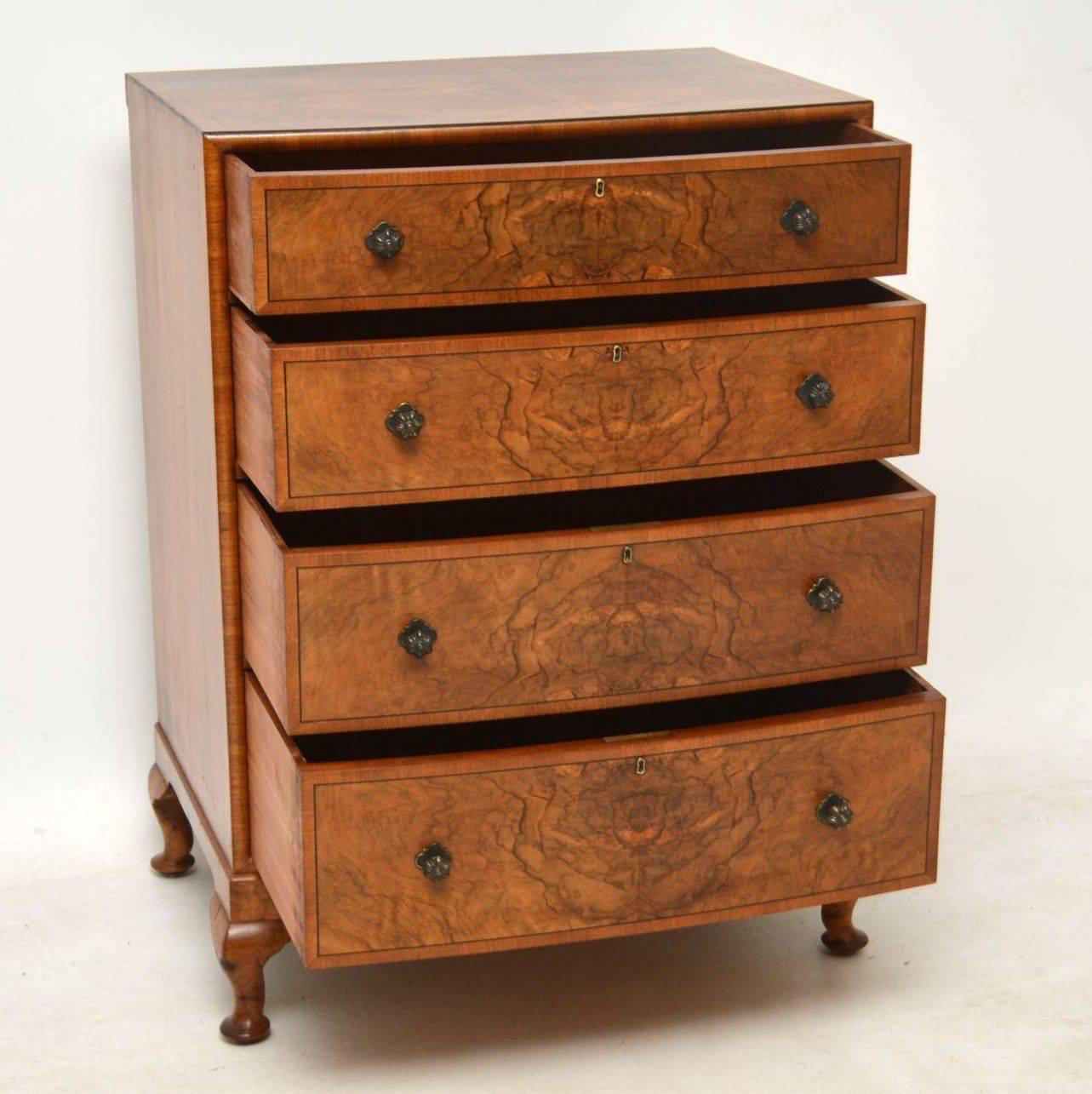 This antique walnut bow fronted chest of drawers is extremely fine quality and has some lovely features. The top and front is a well patterned burr walnut with fine ebony inlays and cross banding. The front edges of the chest are curved and it sits