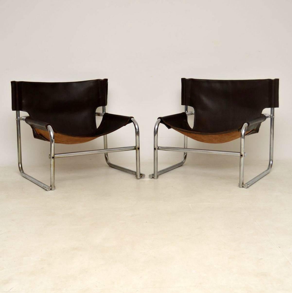 A stylish and iconic pair of vintage armchairs in tubular steel and leather, these were designed by Rodney Kinsman for his company OMK. They were the first armchairs that he designed, titled the T1 chairs, they were first designed in 1967. These are