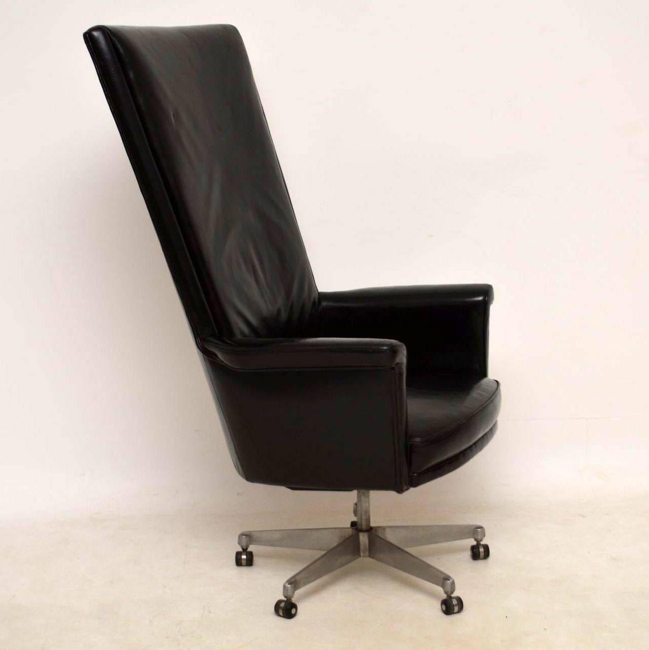 This vintage leather desk chair was made by Howard Keith in the 1960s, it was designed by John Home and is called the 'Trend' chair. It's very rare and extremely impressive, with a super high back, sitting on a splayed brush steel base. The