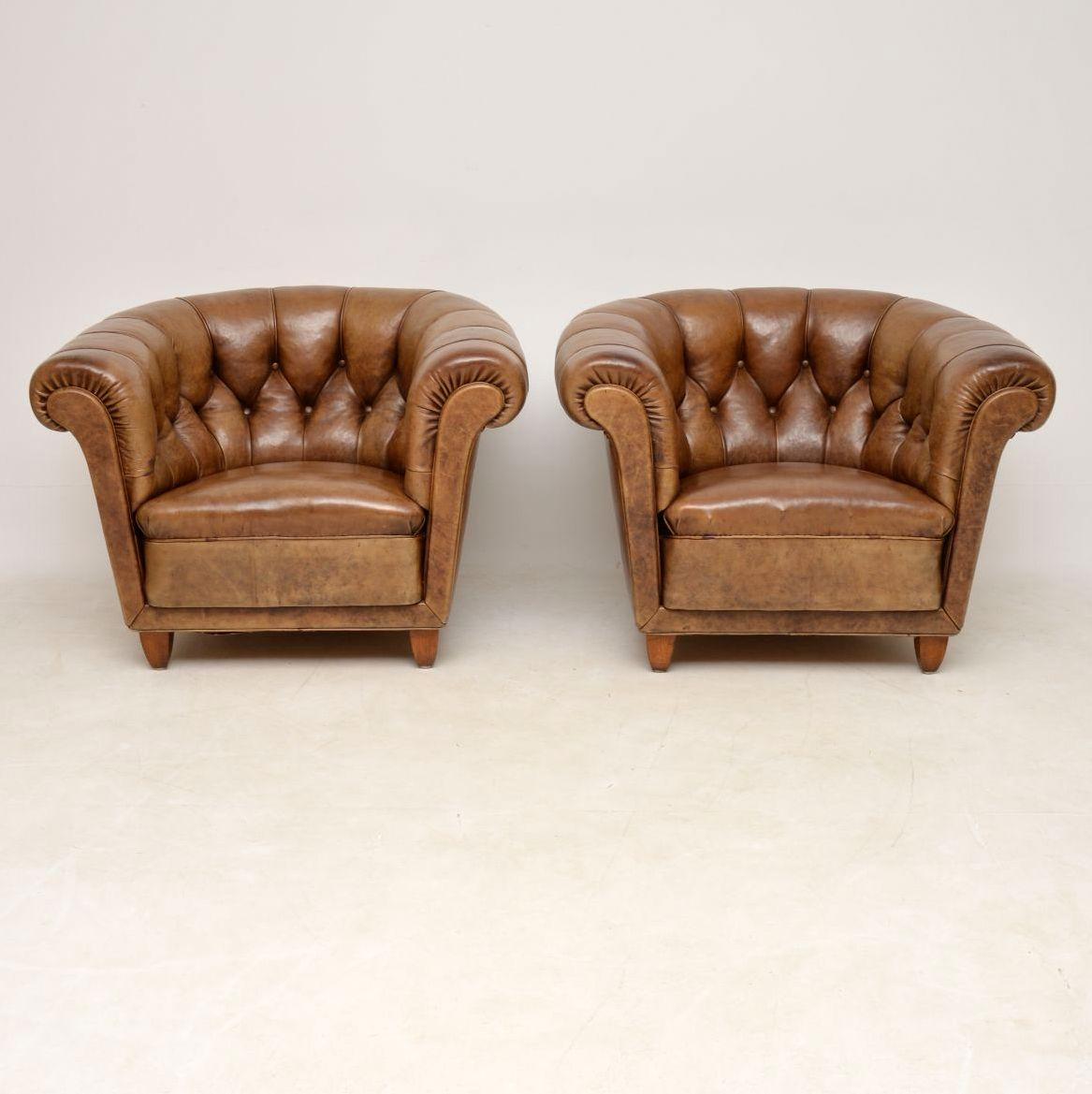 This pair of antique Swedish leather Chesterfield armchairs are absolutely stunning in both design and color. The leather is all original and in good condition. There is on small bit of damage on one of the seats, which has been professionally