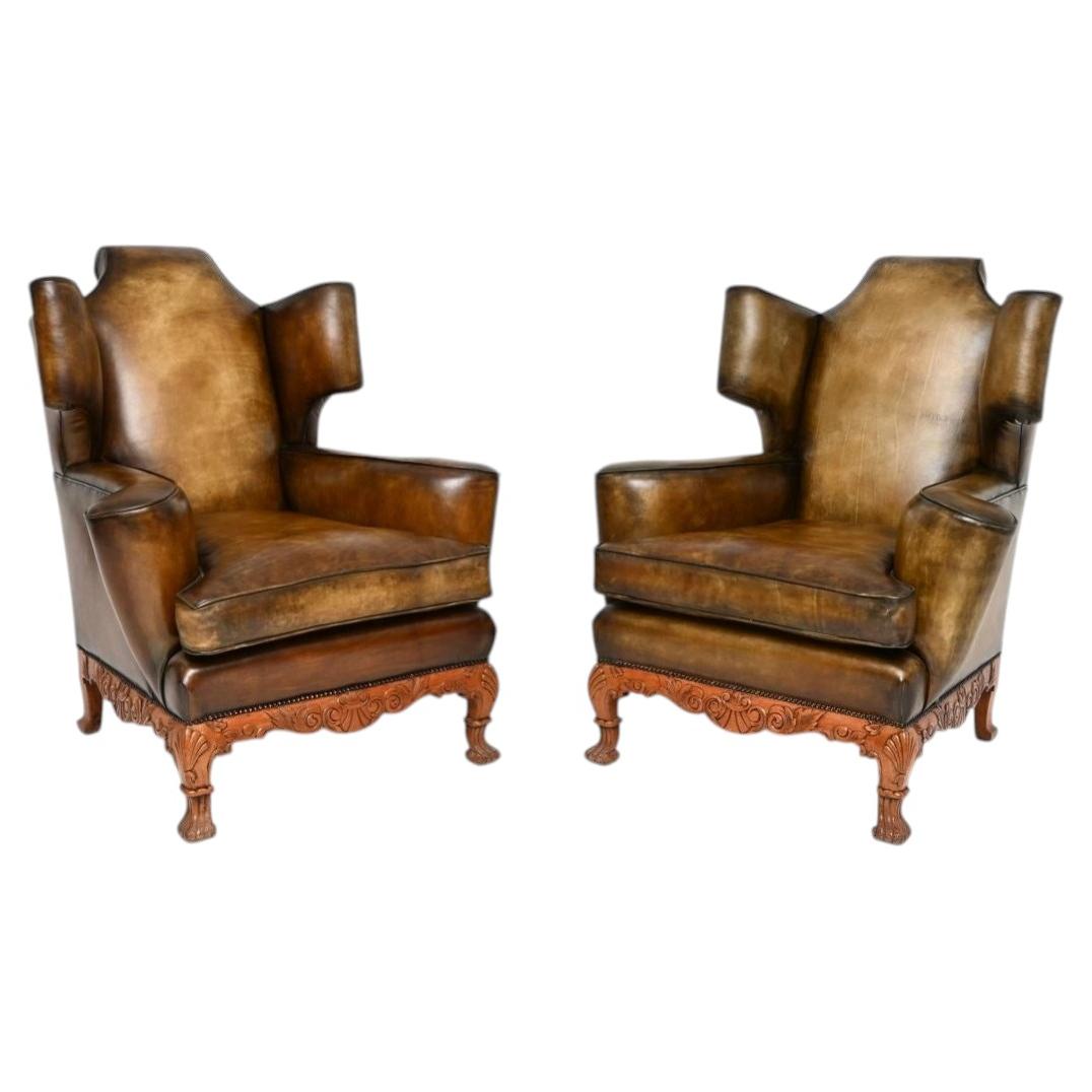Pair of Antique Leather Wing Back Armchairs