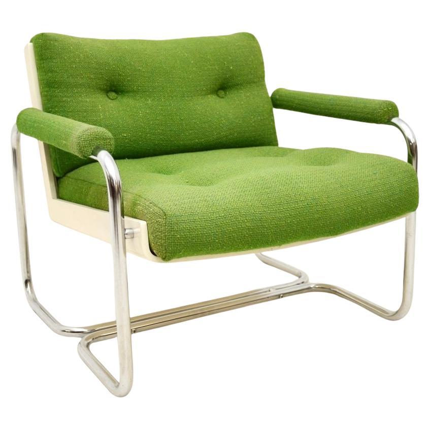 Sillón vintage de acero tubular con respaldo de concha de mediados de siglo