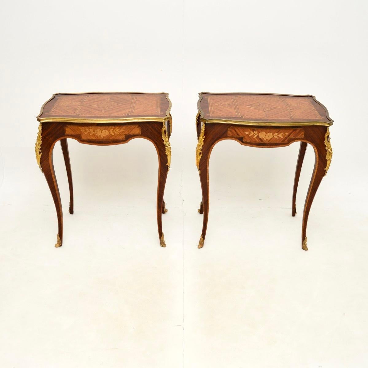 An incredibly beautiful pair of antique French side tables, dating from around the 1890-1900 period.

They are of outstanding quality, they have a stunning design and are very useful size. These have wonderfully intricate floral designs. There are