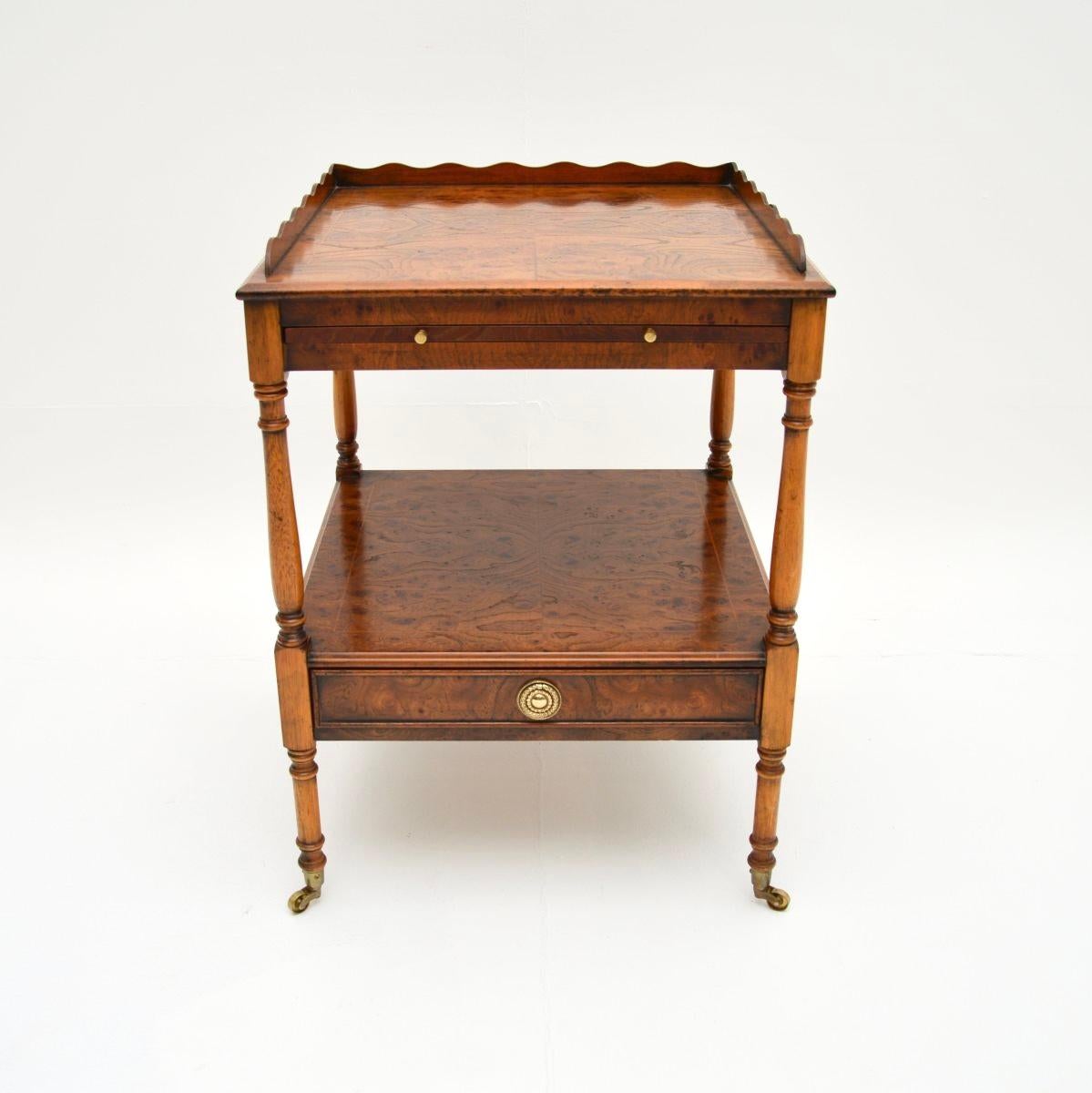 A beautiful antique Georgian style burr elm side table. This was made in England, it dates from around the 1950’s.

It is of excellent quality and has a useful design, with a handy pull out slide shelf beneath the top. This has absolutely stunning