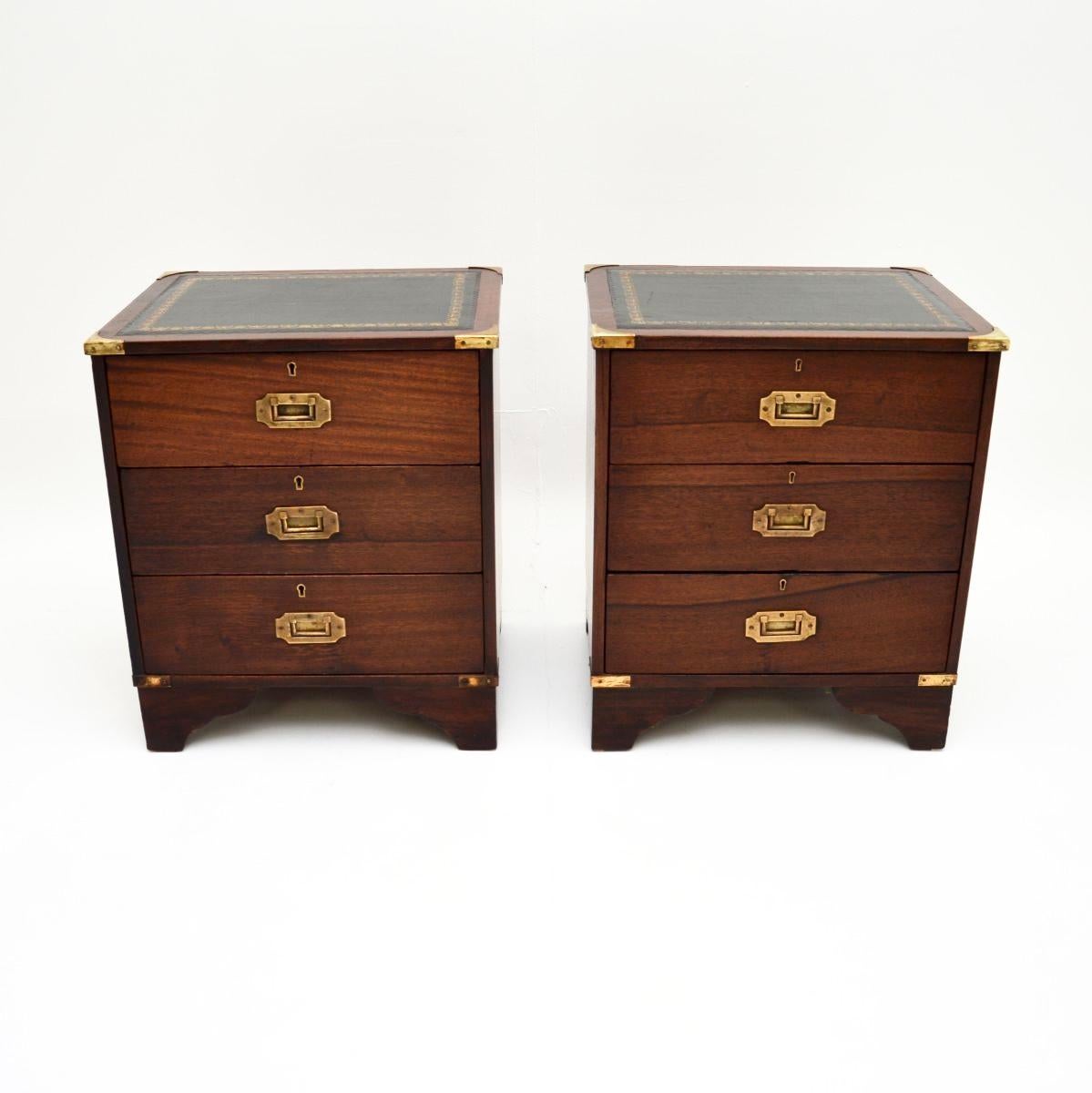 A fantastic pair of antique military campaign style bedside chests. They were made in England, and date from around the 1930’s.

They are of superb quality and are a lovely size, perfect for use as bedside chests or even as side tables in a living