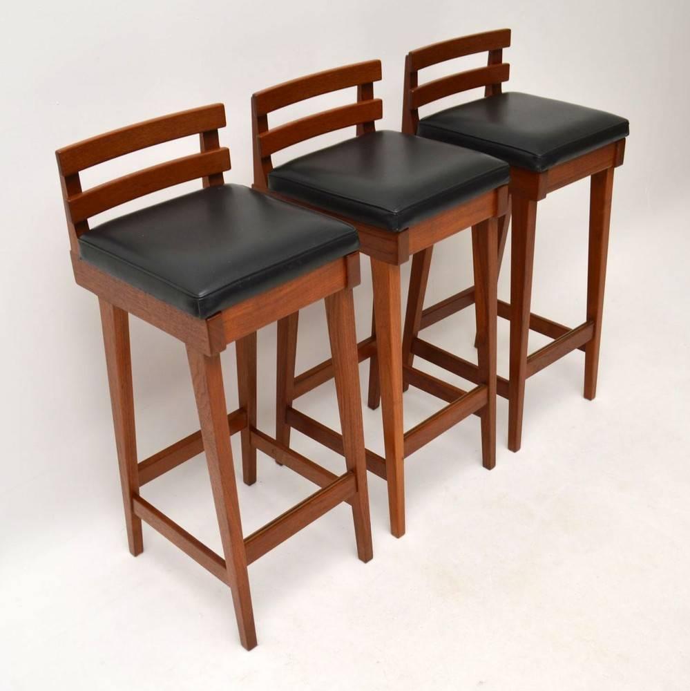 A stunning and very rare set of solid teak bar stools, these were made in Denmark by Dyrlund and they were designed by Erik Buch. These date from the 1960s-1970s and the condition is excellent, we have had the frames stripped and re-polished to a