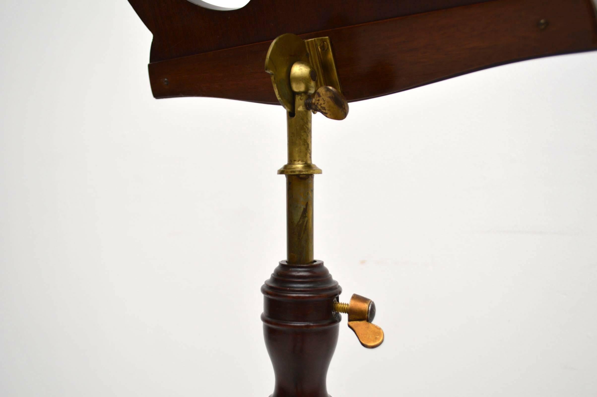 Original antique Regency adjustable music stand in mahogany with brass fittings. This is very rare item is in excellent original condition and is very stylish for that period. The top section is adjustable and also can be raised up and down. The top