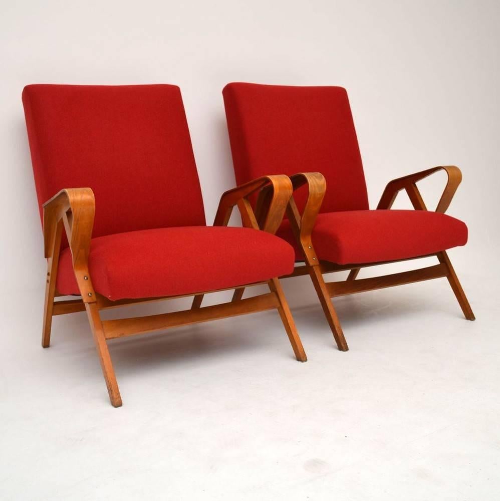 A stunning pair of armchairs, these were designed by Tatra Nabytok and were made in Czechoslovakia during the 1950s. The frames are clean, sturdy and sound, with only some minor wear here and there. We have had these newly re-upholstered in a