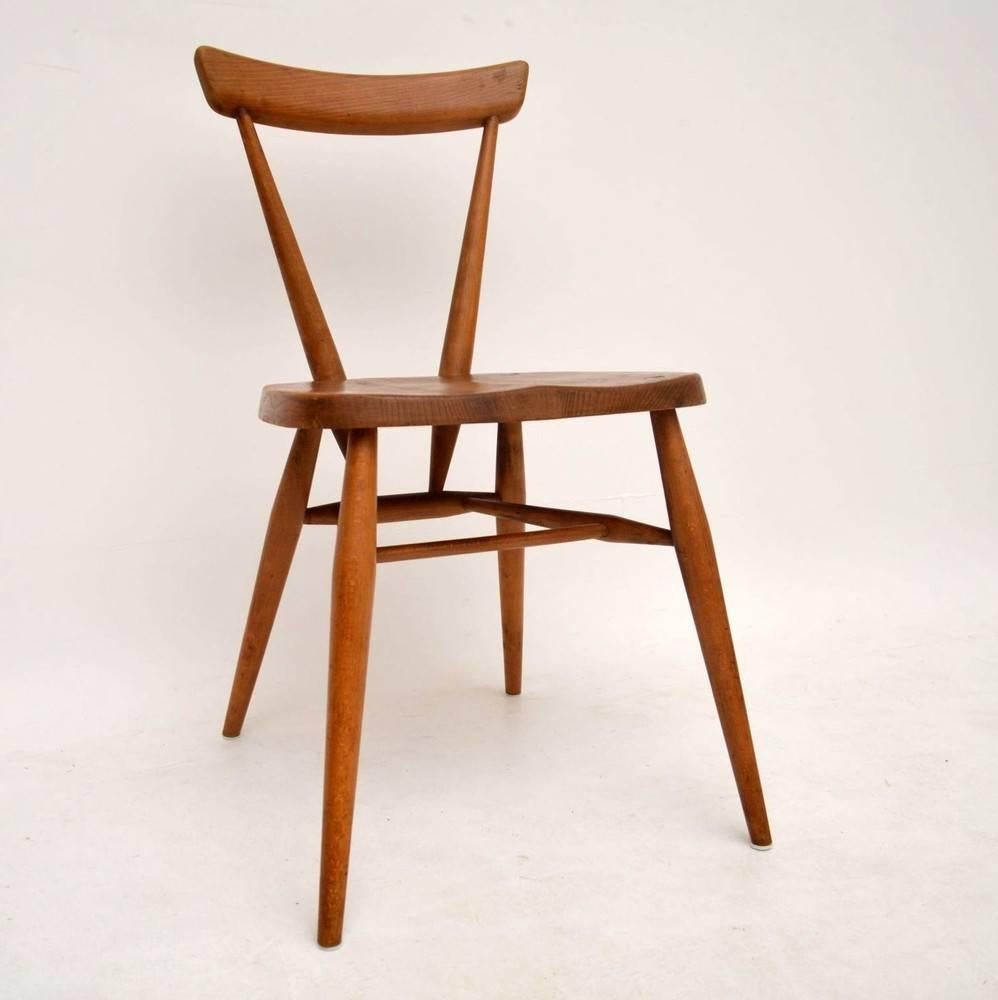 A very stylish and extremely well made chair by Ercol, this is quite early and dates from the 1950s-1960s. It is in good condition for its age, it is sturdy and clean, with some minor wear to the polish here and there. This would have been part of a