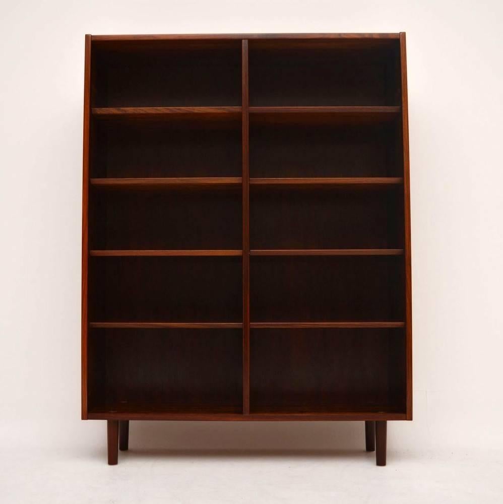 A stylish and very practical rosewood open bookcase, this was made in Denmark and dates from the 1960s. It was designed by Poul Hundevad, the quality and condition is superb throughout; we have had this fully stripped and re-polished. the shelves