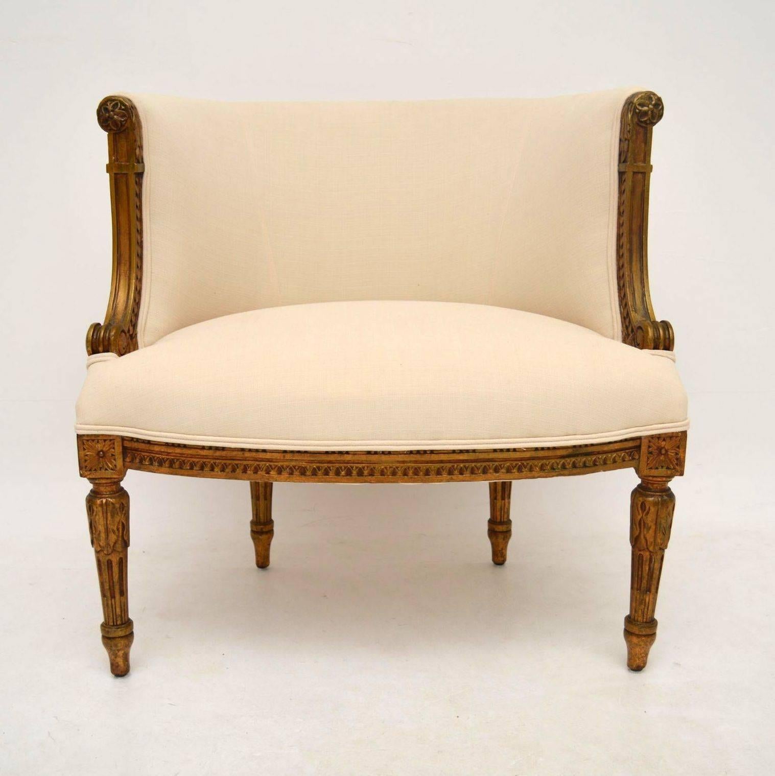 Attractive small antique French giltwood armchair in good original condition, having just been re-upholstered in a cream fabric with double piping. The gilding has a nice original look, with plenty of Fine carved detail within the wood. Please check