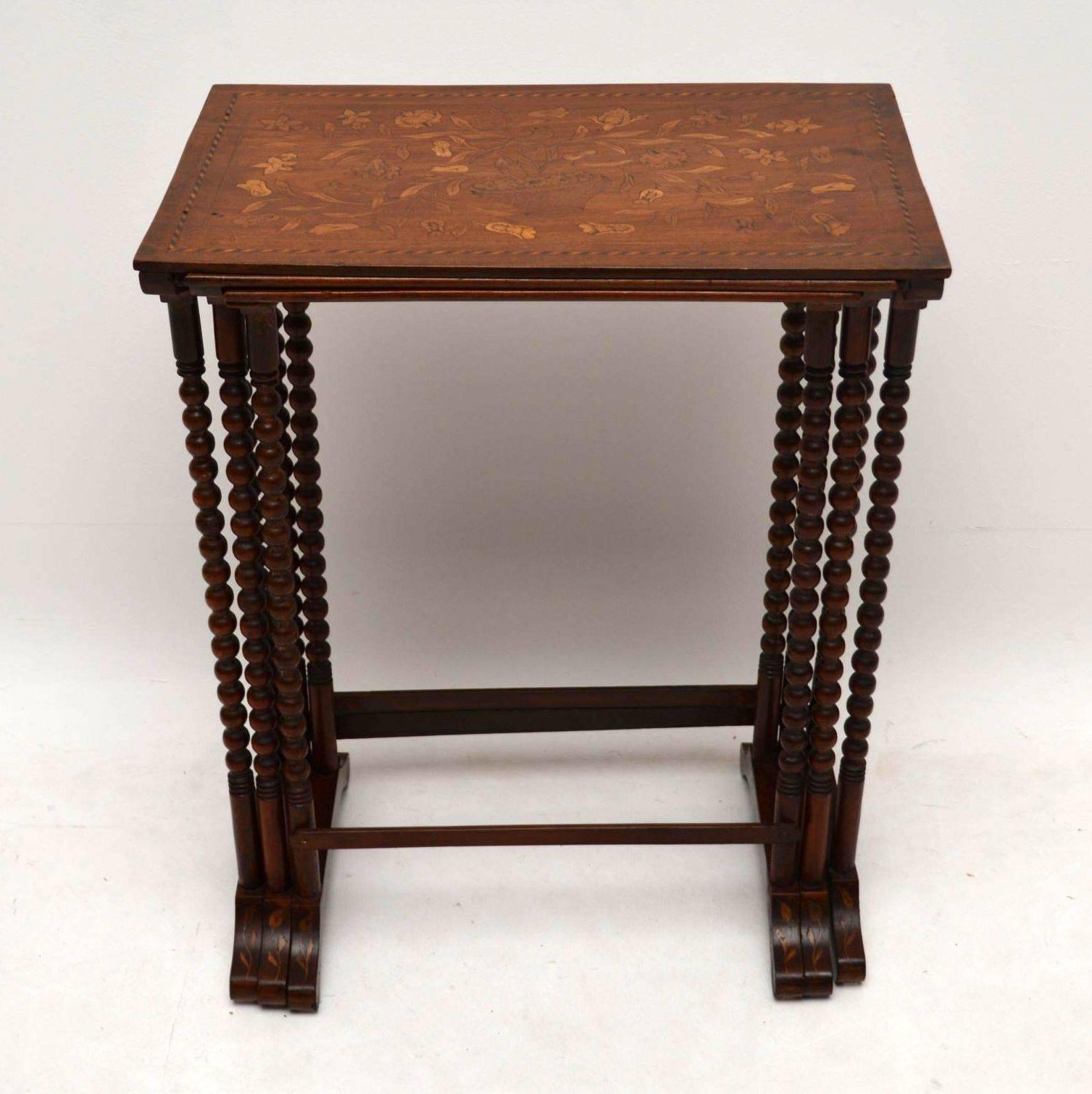 Rare antique nest of Dutch Marquetry tables in exceptionally good original condition, dating from circa 1840s-1860s period. They are mahogany, with the marquetry all-over the tops, sides and even on the feet. The tables are structurally sound, with