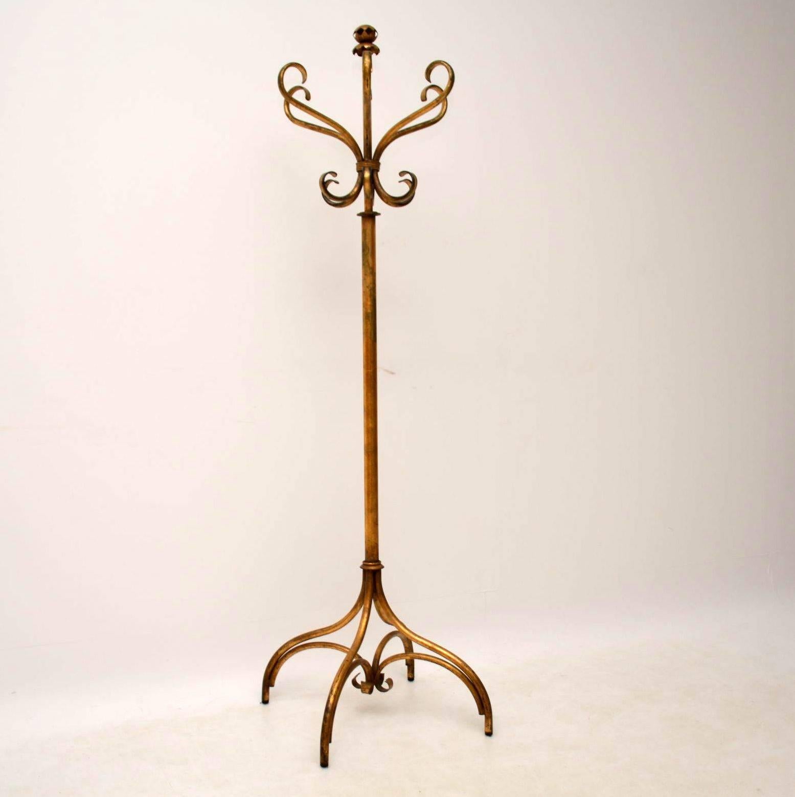 Antique gilt metal hat/coat stand in the style of an original Thonet bentwood hat/coat stand. This a very unusual item and must be a designer piece and my guess is that it's possibly Italian. The gilt work is naturally aged and you can see the base