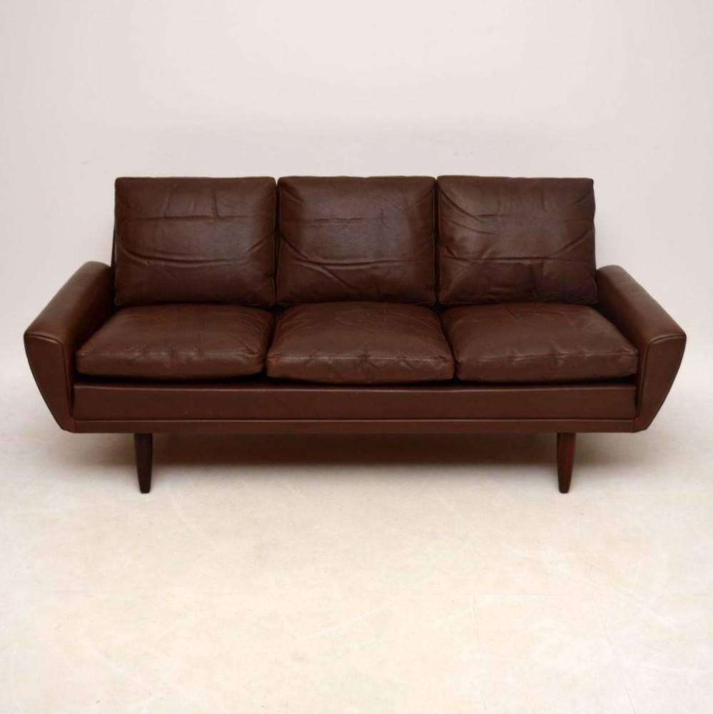 This is a top quality and very comfortable sofa, it is a famous design by Gustav Thams, called the 64 sofa after the year in which this was designed. This one dates from the 1960s-1970s, and is upholstered in brown leather, the legs are solid