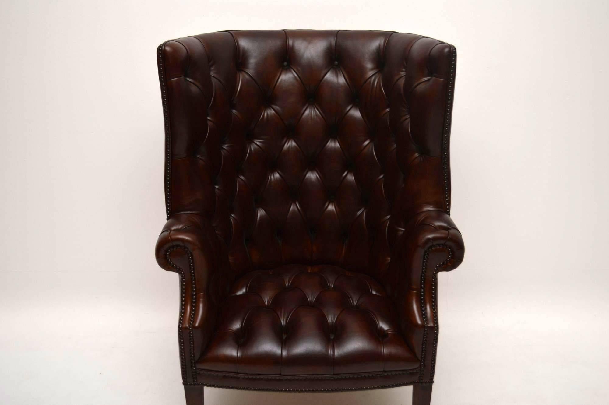 Contemporary Pair of Antique Leather Porters Wing Armchairs
