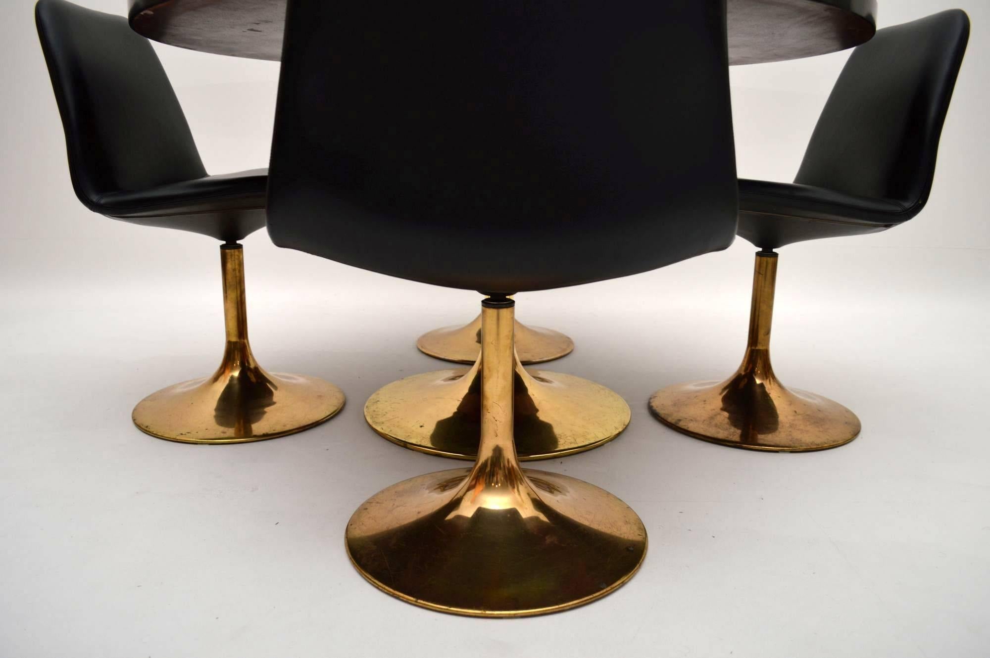 A stunning retro dining set by Borje Johanson, this was made in Sweden, it dates from the 1960s. The dining table has been ebonised and re-polished, the condition is perfect on the top. The dining chairs are covered in black vinyl, which is also in