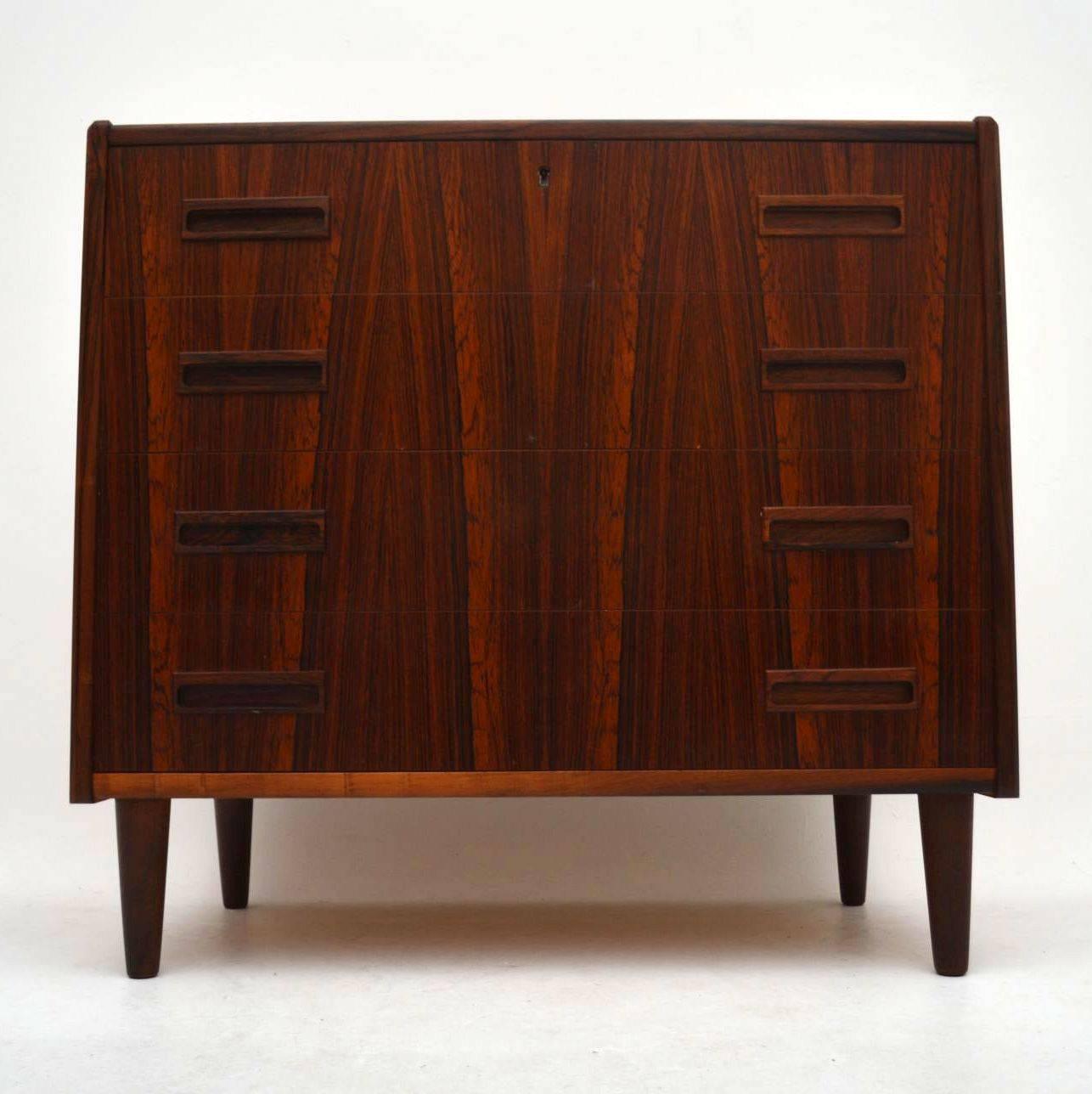 A beautiful and stylish Danish vintage chest of drawers in rosewood, this was designed by Borge Seindal for Westgaard, it dates from the 1960s. The condition is superb for its age, with only some extremely minor wear here and there. It has a