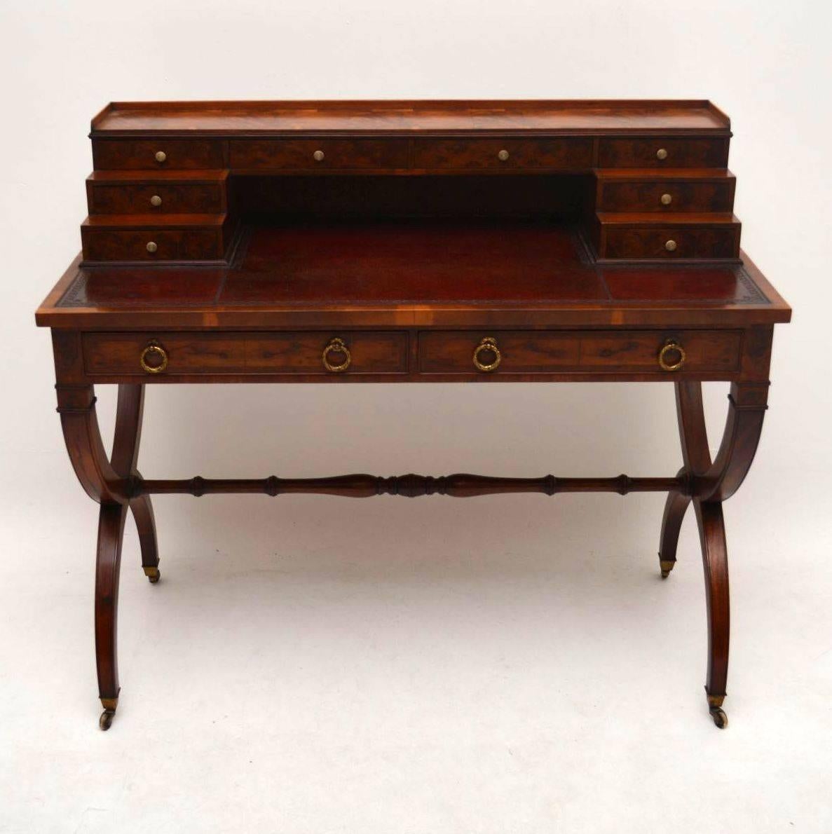 Antique yew wood and mahogany writing table desk of extremely fine quality & in good original condition, dating from around the 1910 period. The top section consists of an arrangement of stepped up small drawers with with simulated bone handles,