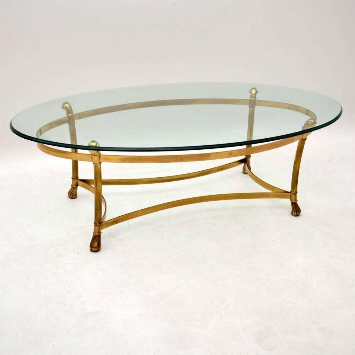 A stunning and extremely well made vintage coffee table, with a beautiful brass base and thick tempered glass top. This dates from around the 1970s and it is in superb condition for its age. There is just some extremely minor wear to the frame, and