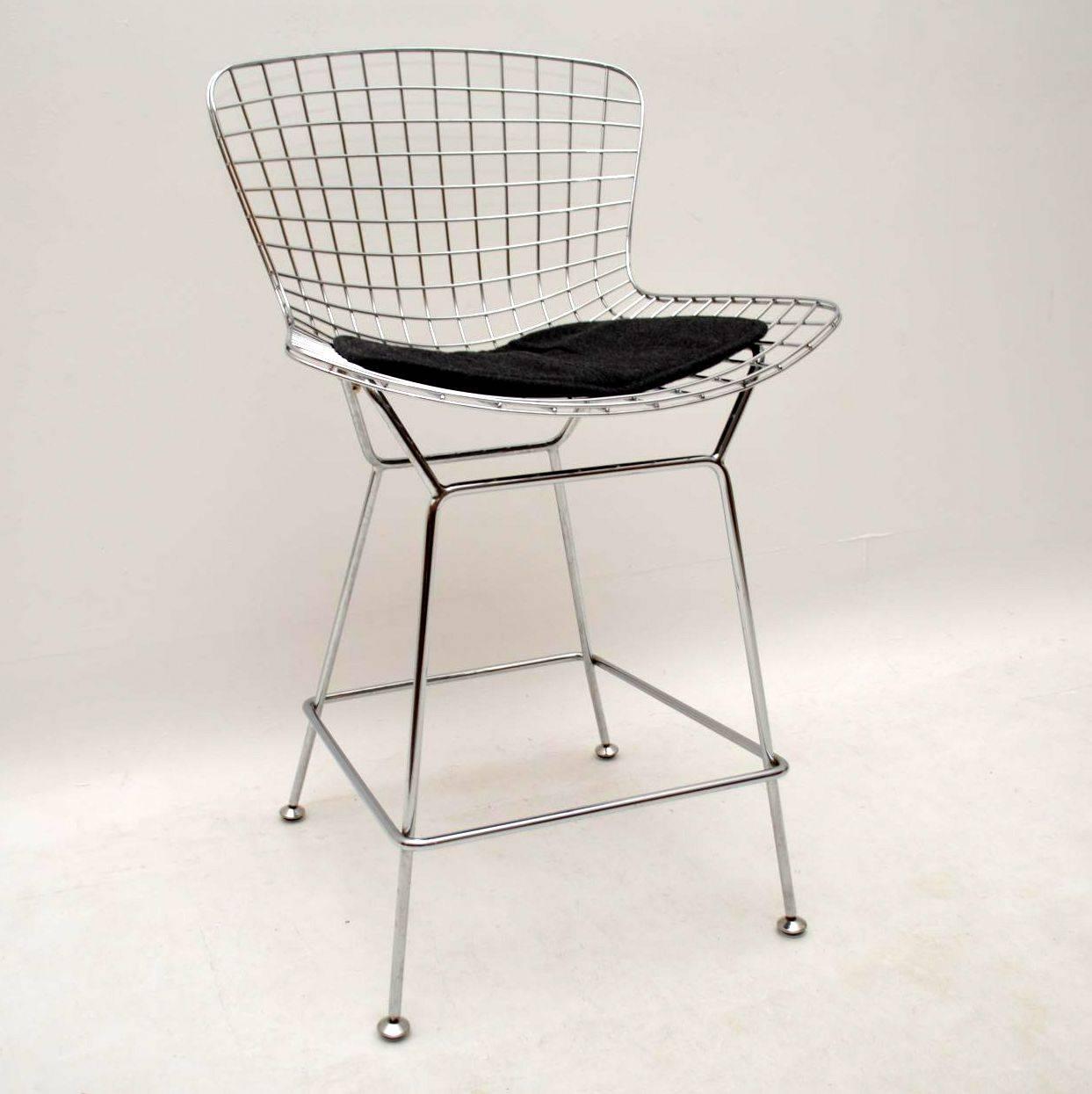 A very stylish set of four vintage bar stools, these were designed by Harry Bertoia, they date from circa 1960s-1970s. The condition is excellent for their age, with only some minor wear here and there. The charcoal colored seat pads are in good