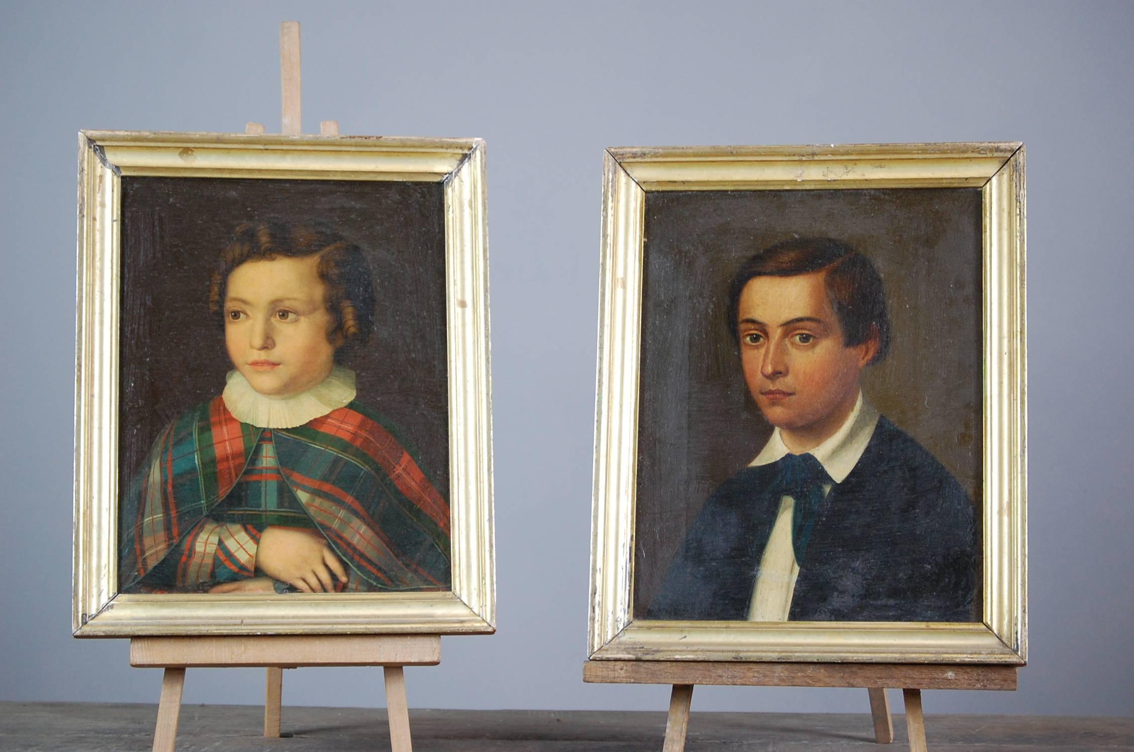 Pair of Naïve 19th century English oil on canvas children portraits. Original unrestored condition found in their original frames. Dated verso (on stretcher) 4/3/90, with each child's name and a signature.