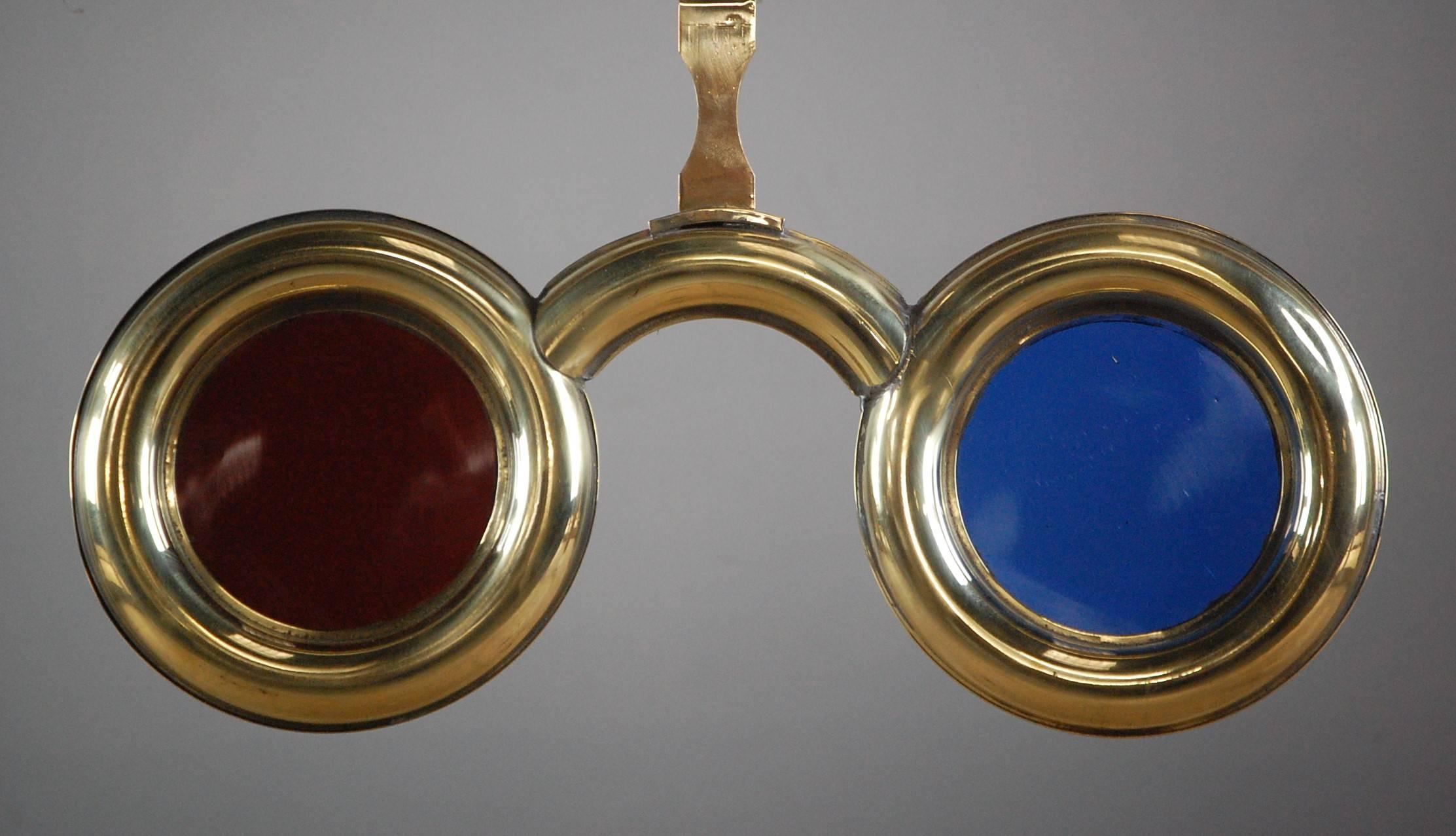 Early 20th century optician trade sign, in brass, with original glass lenses, highly polished finished, restored fixing point, France, circa 1900.
