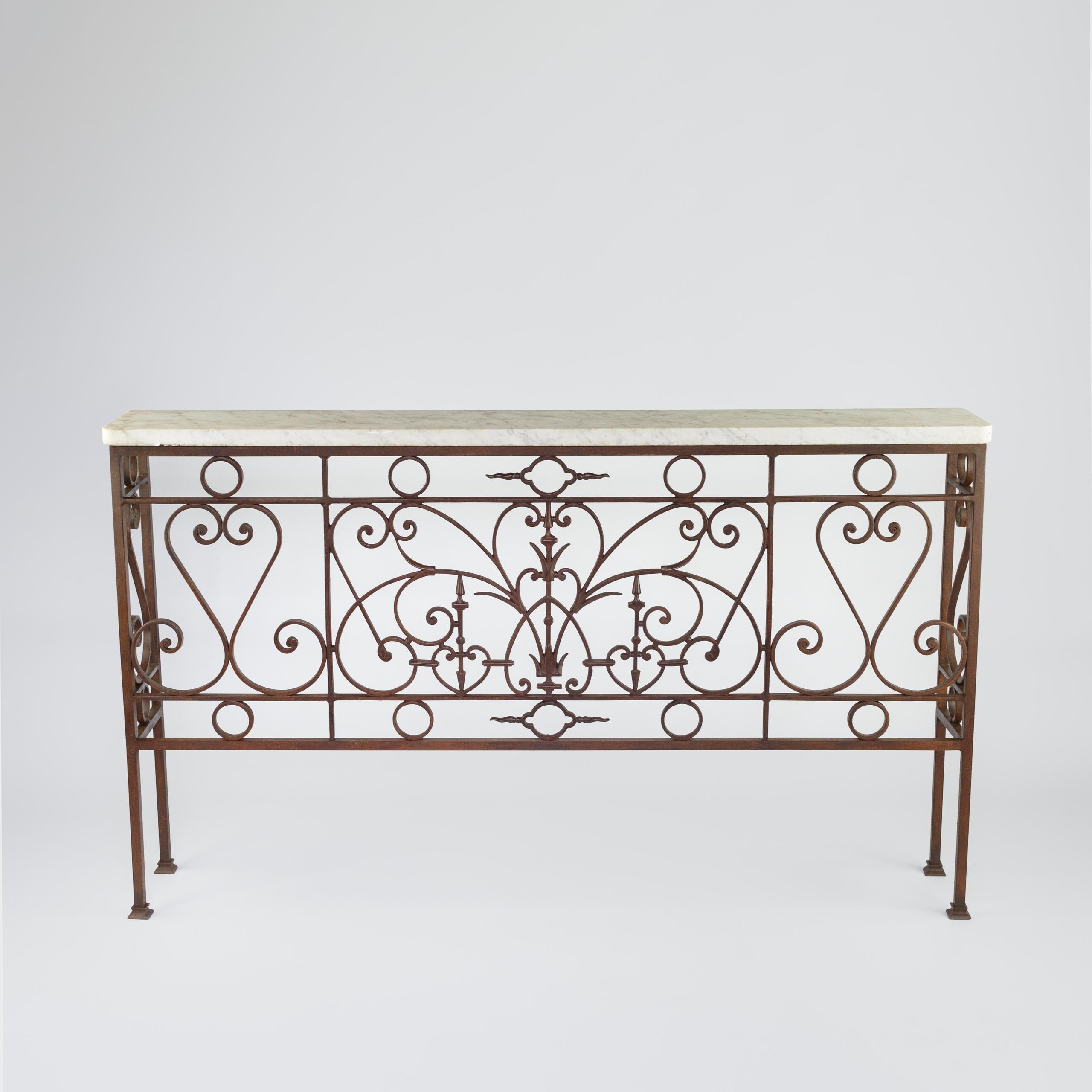 Impressive Large Iron and Marble console table. 19th Century Iron Juliette balcony, with adaptations to use as a large free standing console table, Late 19th or early 20th Century Marble slab top. France. Circa 1900.