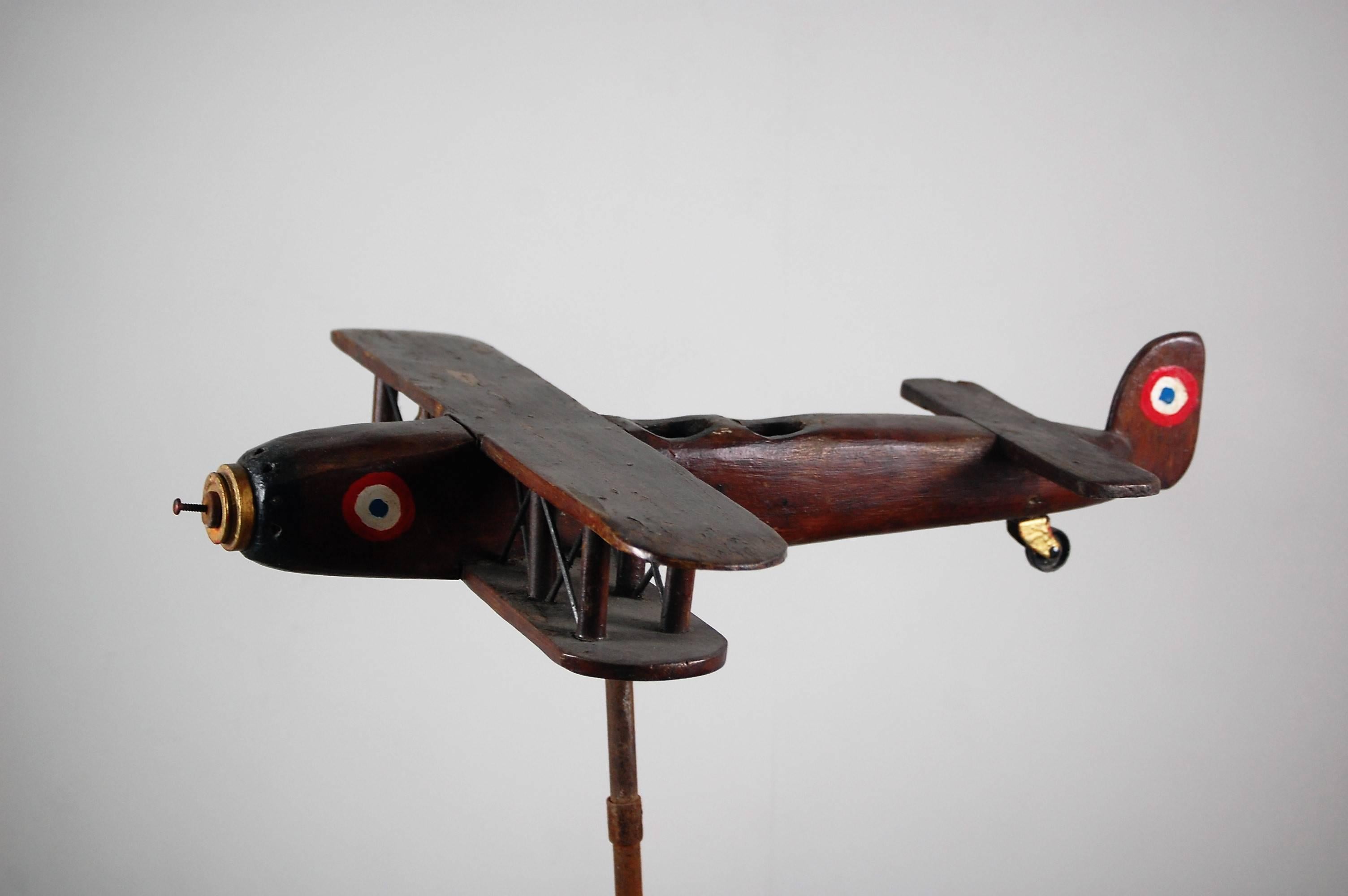 A wonderful scratch built Bi plane weathervane, from solid wood and metal, with two cockpits, hand-painted, some light paint loss and patination, very light if any outdoor use. Wonderful decorative piece, French, circa 1950. Later bespoke steel