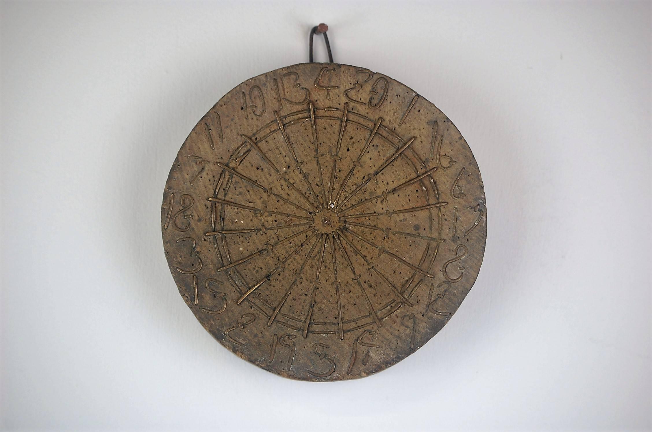 A diminutive early vernacular dart board. Well patinated, Log end wood and metal wire. England (Probably Manchester) Circa 1880.