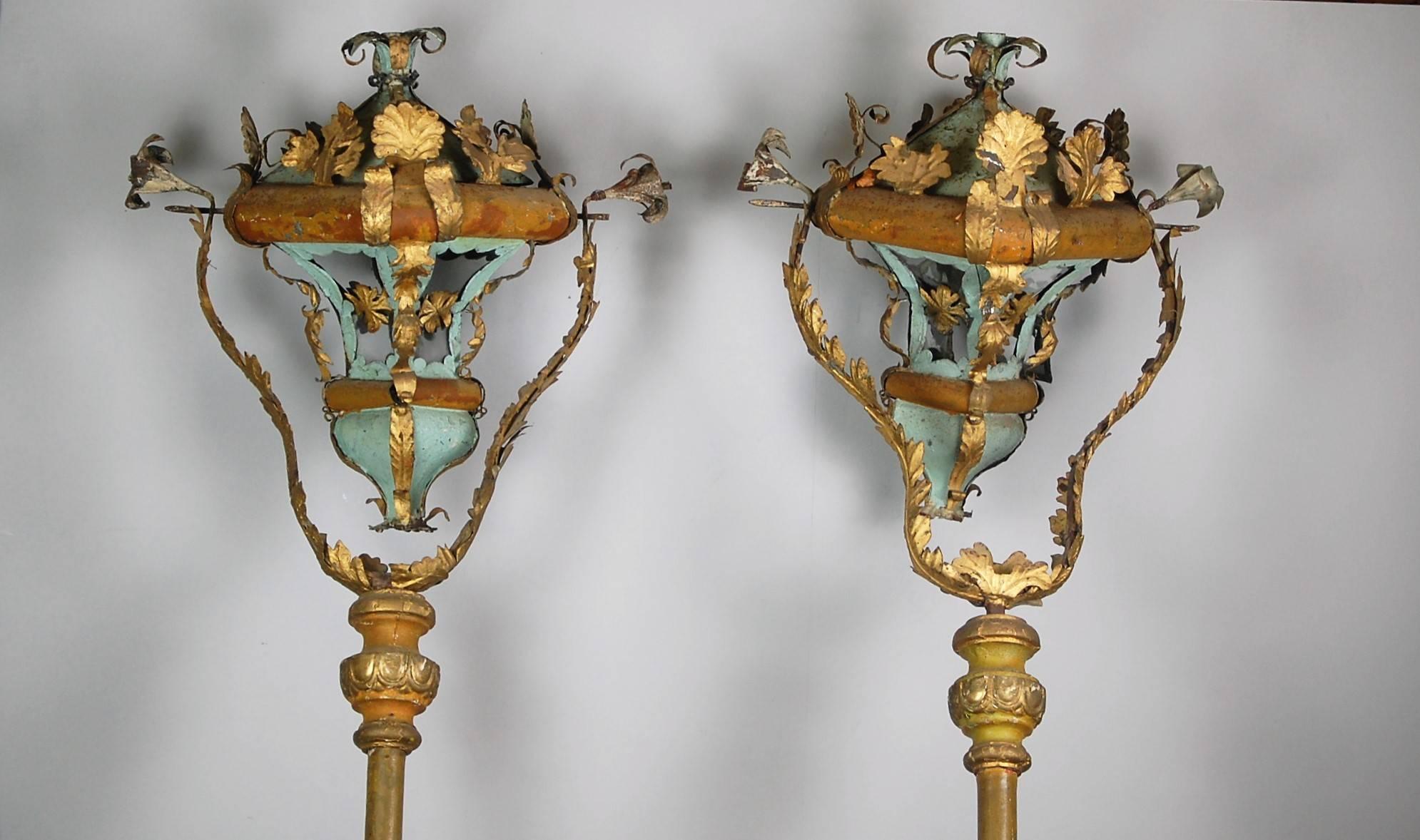 Wonderful pair of late 18th century Venetian processional lanterns, of tole and glass with the staffs of wood. Beautiful color and patination. Would have been used during formal church ceremonies. Some minor losses to the glass and tole. These have