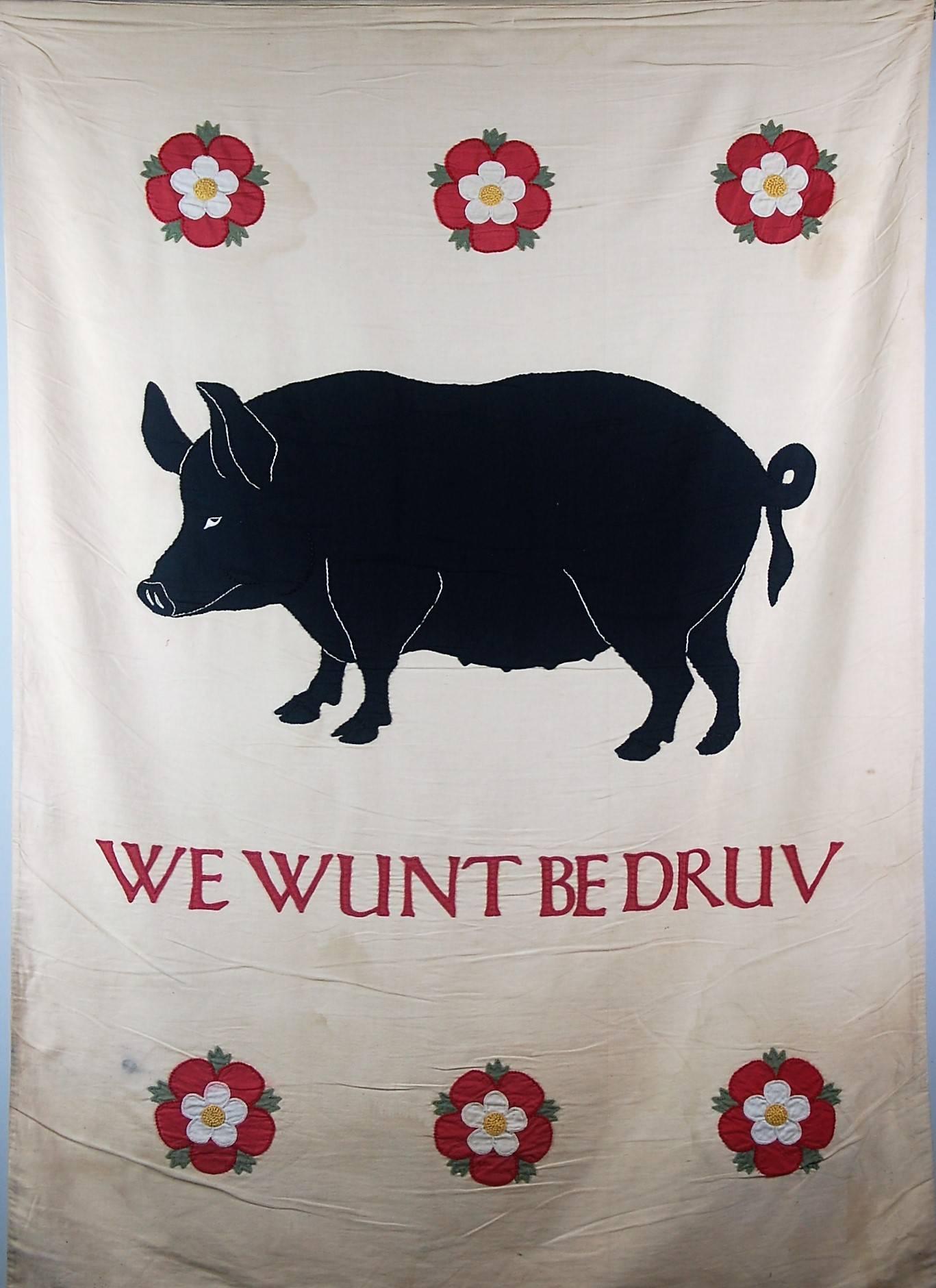 Wonderful large applique processional banner depicting a Sussex pig and six roses, with the phrase 