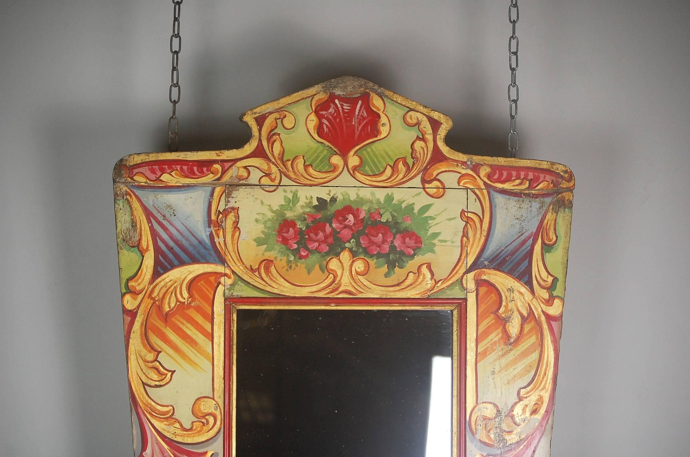 Wonderfully nostalgic late 19th century English fairground mirror, originally from the centre of the gallopers. Fitted with a wonderful period sparkly mercury plate mirror. English, circa 1880.