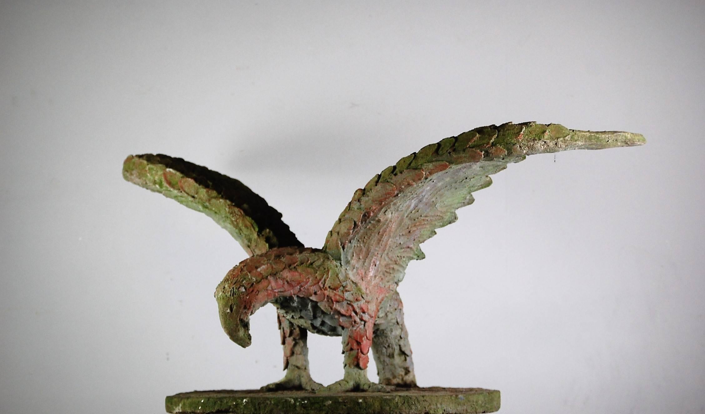 Early 20th century vast eagle sculpture, heavily weathered with remnant paint. Handmade, (not cast) in Brutalist fashion, France, circa 1920.