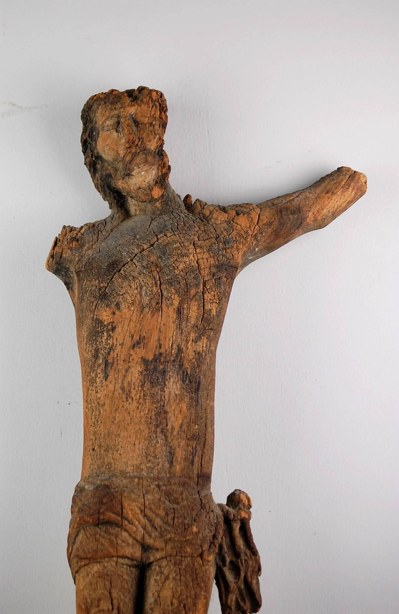 Heavily distressed carved wood late 17th century Corpus Christi, originating in France, remnant paint, France, circa 1650.